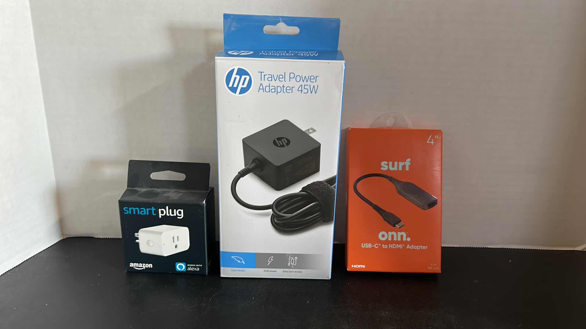 Photo 1 of THREE NEW BOXED ELECTRONICS (SMART PLUG - 2 POWER ADAPTERS