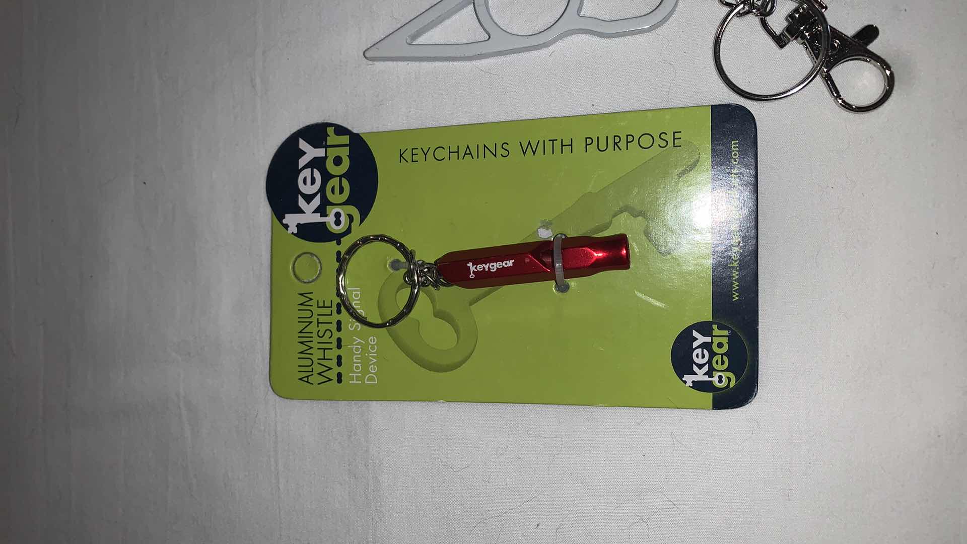 Photo 1 of KEYCHAIN PROTECTION SET WITH WHISTLE AND CAT EYES MELEE