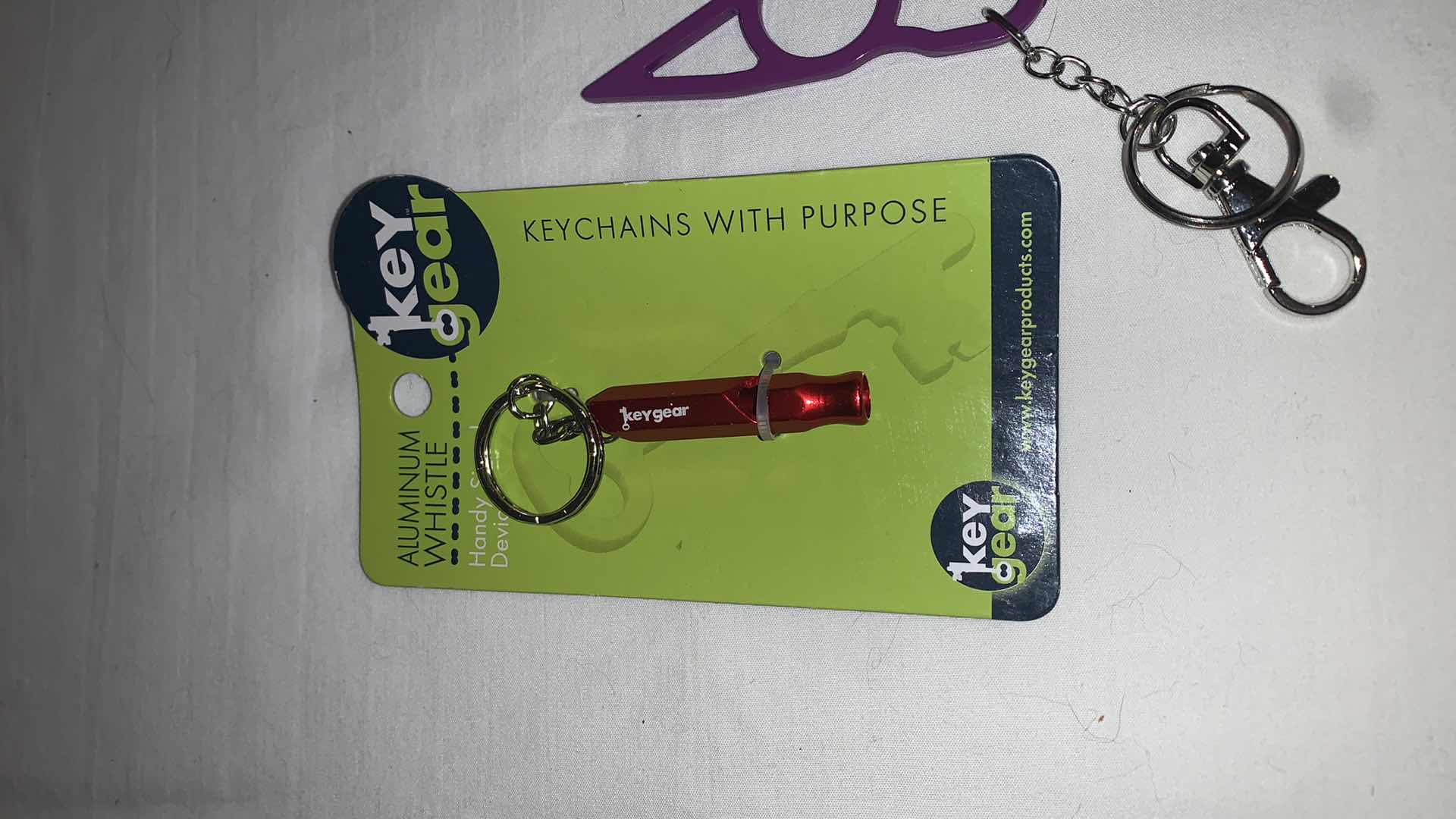 Photo 2 of KEYCHAIN PROTECTION SET WITH WHISTLE AND CAT EYES MELEE