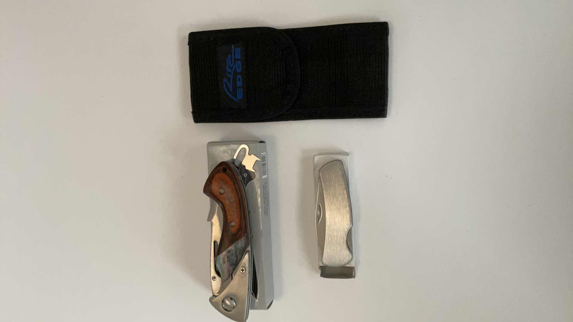 Photo 1 of 2 POCKET KNIVES AND HOLDER