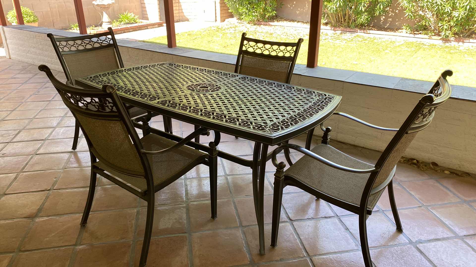 Photo 1 of ALUMINUM PATIO TABLE 67” X 38” H29” WITH 4 CHAIRS