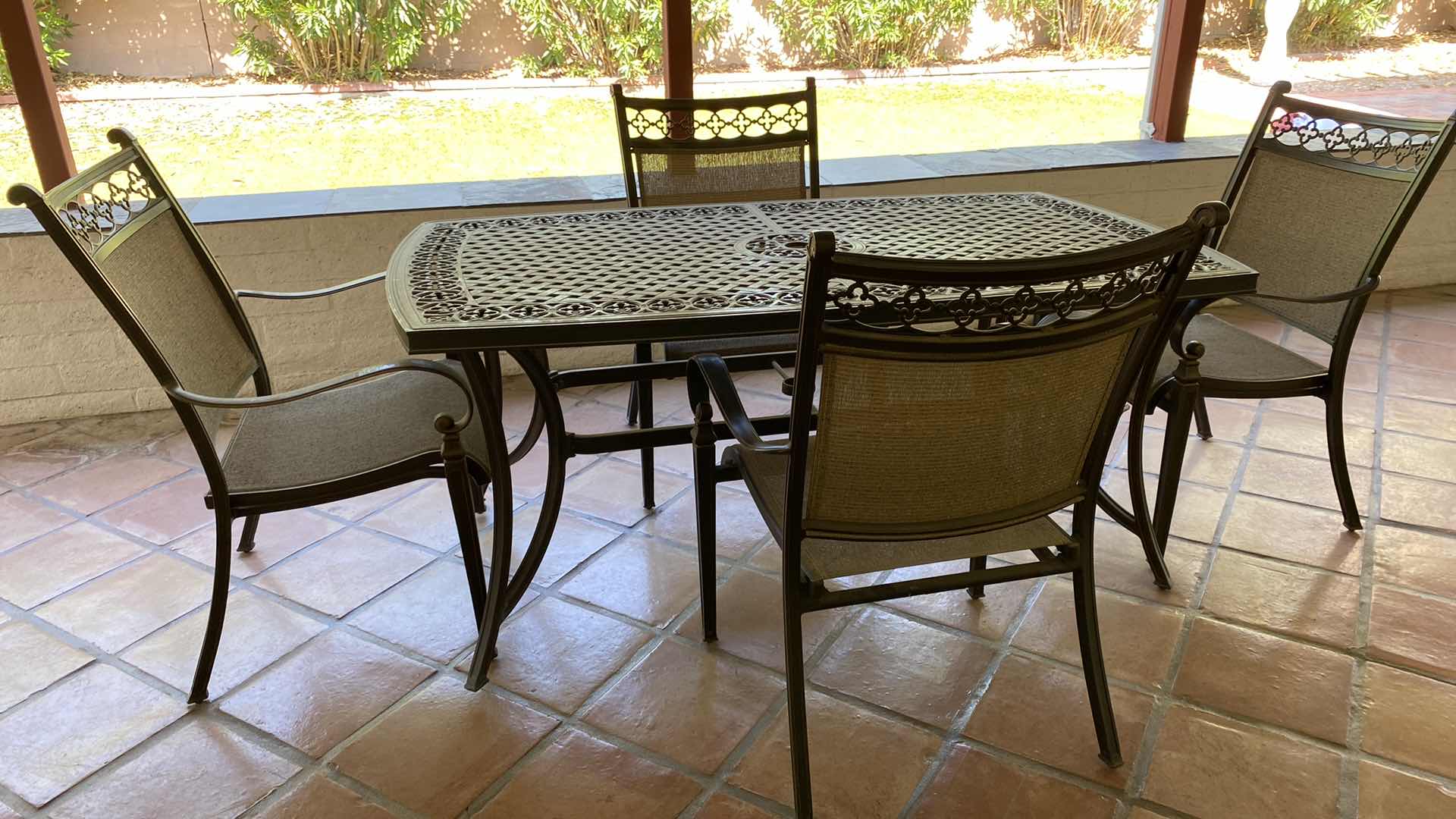 Photo 1 of ALUMINUM PATIO TABLE 67” X 38” H29” WITH 4 CHAIRS