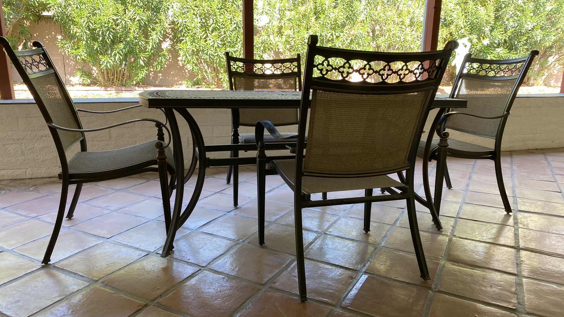 Photo 1 of ALUMINUM PATIO TABLE 67” X 38” H29” WITH 4 CHAIRS