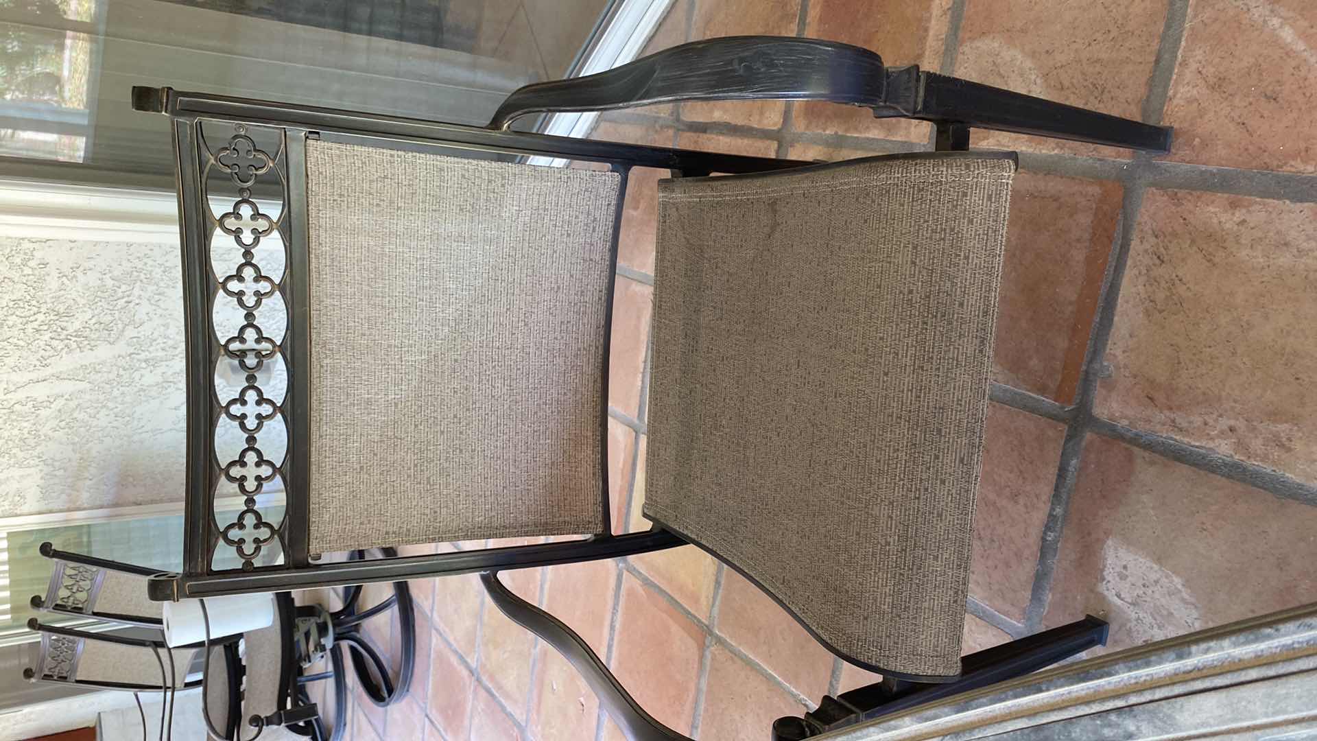 Photo 1 of ALUMINUM PATIO TABLE 67” X 38” H29” WITH 4 CHAIRS