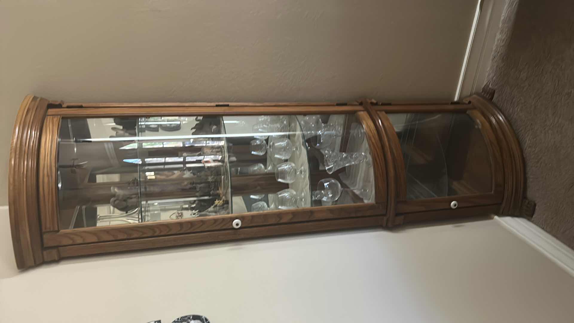 Photo 1 of LIGHTED WOOD CORNER CURIO CABINET (CONTENTS SOLD SEPARATELY) 25” x 17” x H 76”