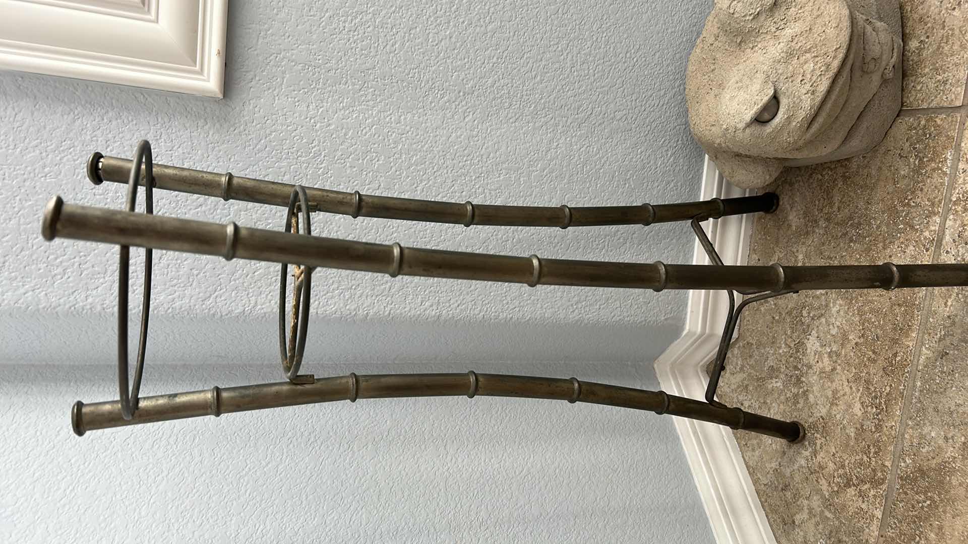 Photo 1 of OUTDOOR DECOR 2  PIECE - METAL BAMBOO PLANT STAND  H 28”AND HEAVY CERAMIC FROG  W SIGNATURE RANKIN