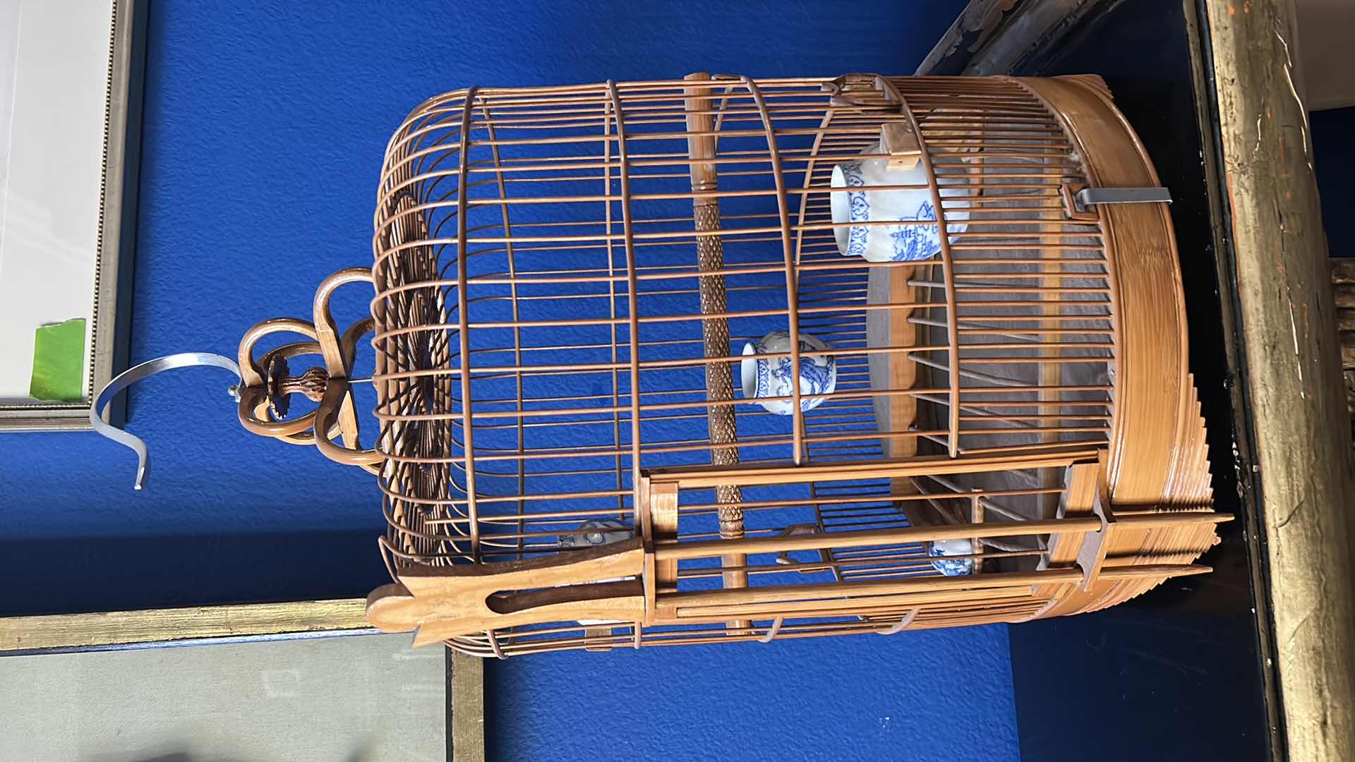 Photo 1 of ANTIQUE CHINESE WOVEN HANDMADE BIRDCAGE WITH PORCELAIN POTTERY FEEDERS 14” x 23”