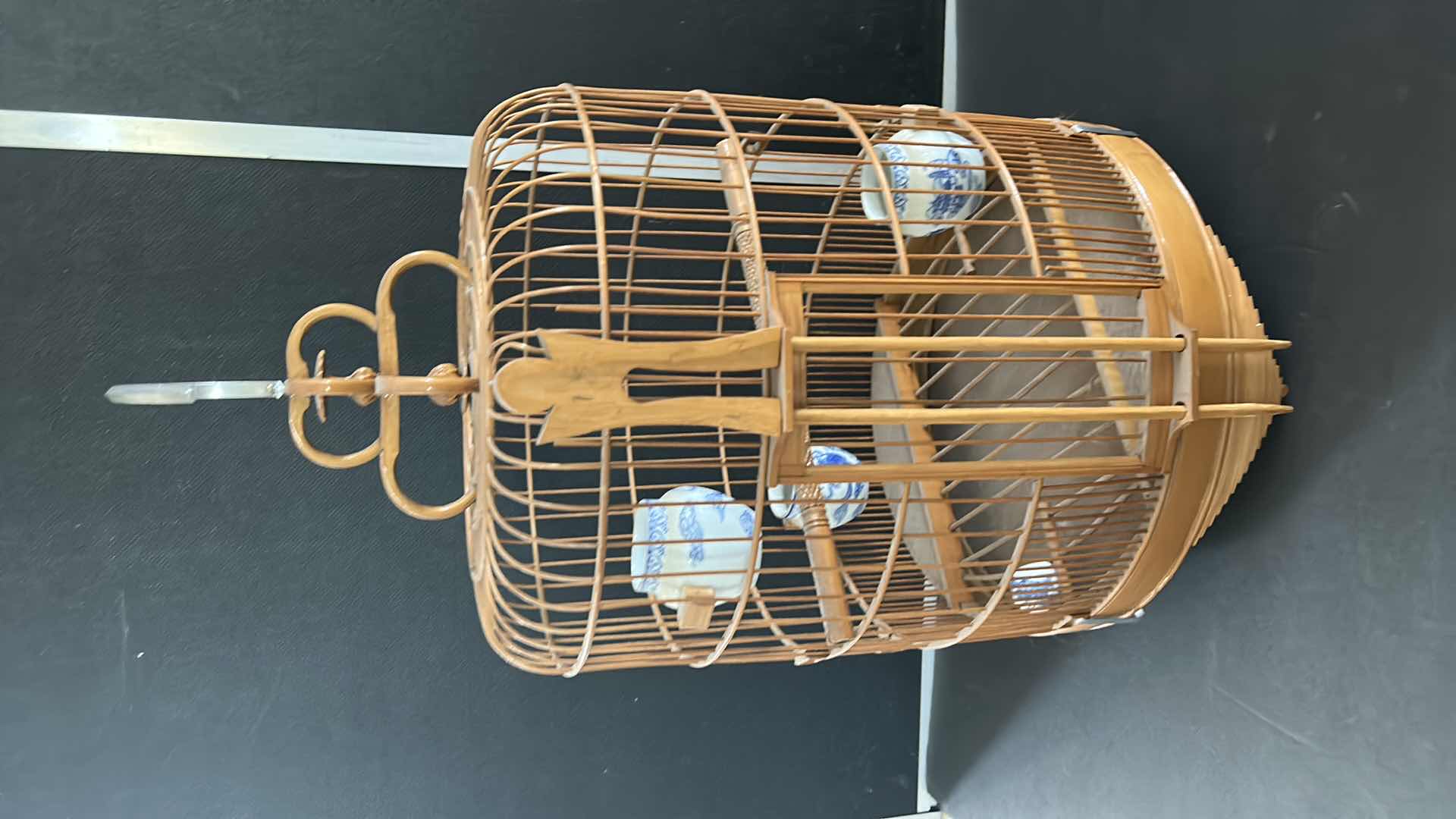 Photo 1 of ANTIQUE CHINESE WOVEN HANDMADE BIRDCAGE WITH PORCELAIN POTTERY FEEDERS 14” x 23”