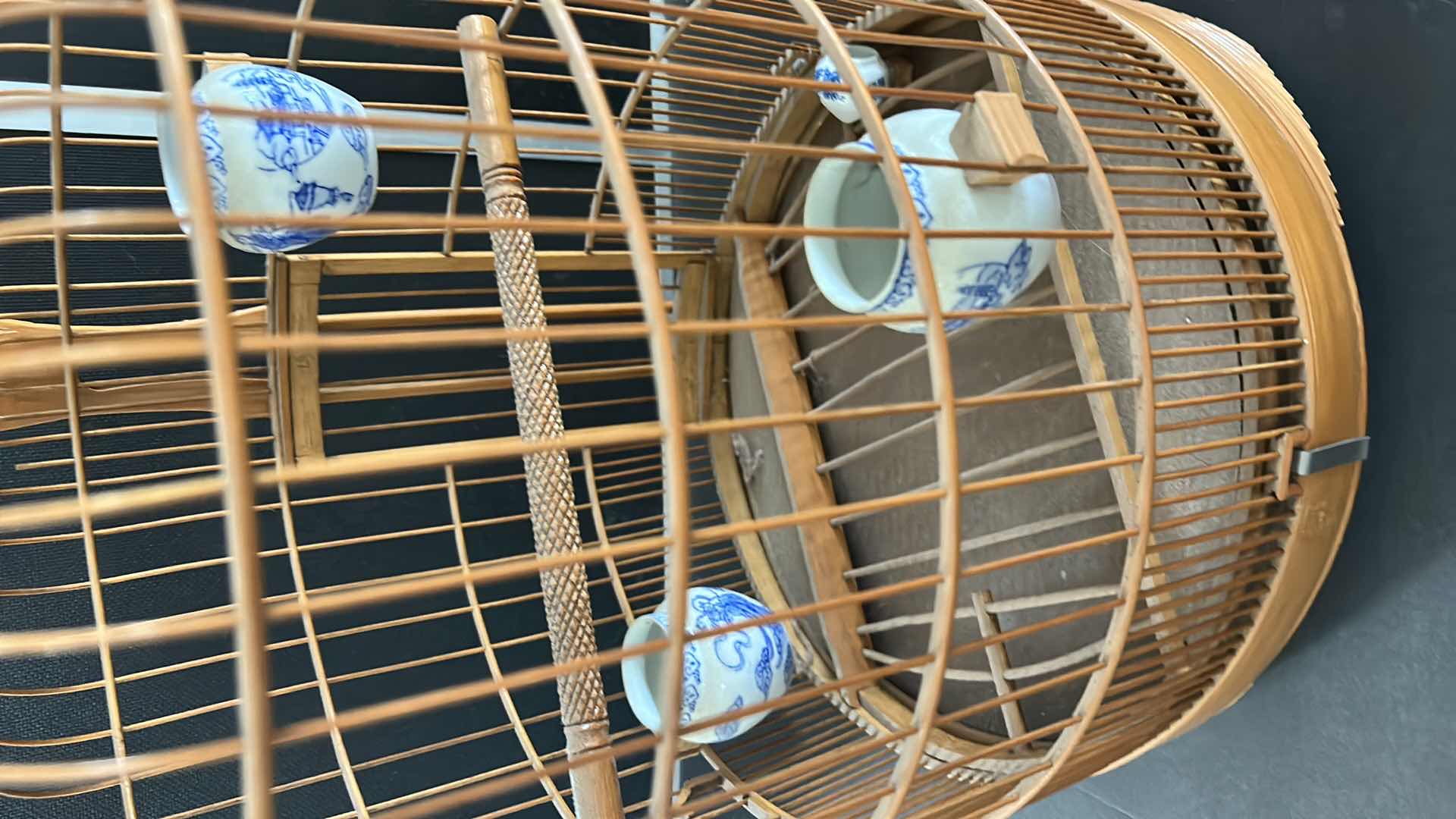Photo 1 of ANTIQUE CHINESE WOVEN HANDMADE BIRDCAGE WITH PORCELAIN POTTERY FEEDERS 14” x 23”