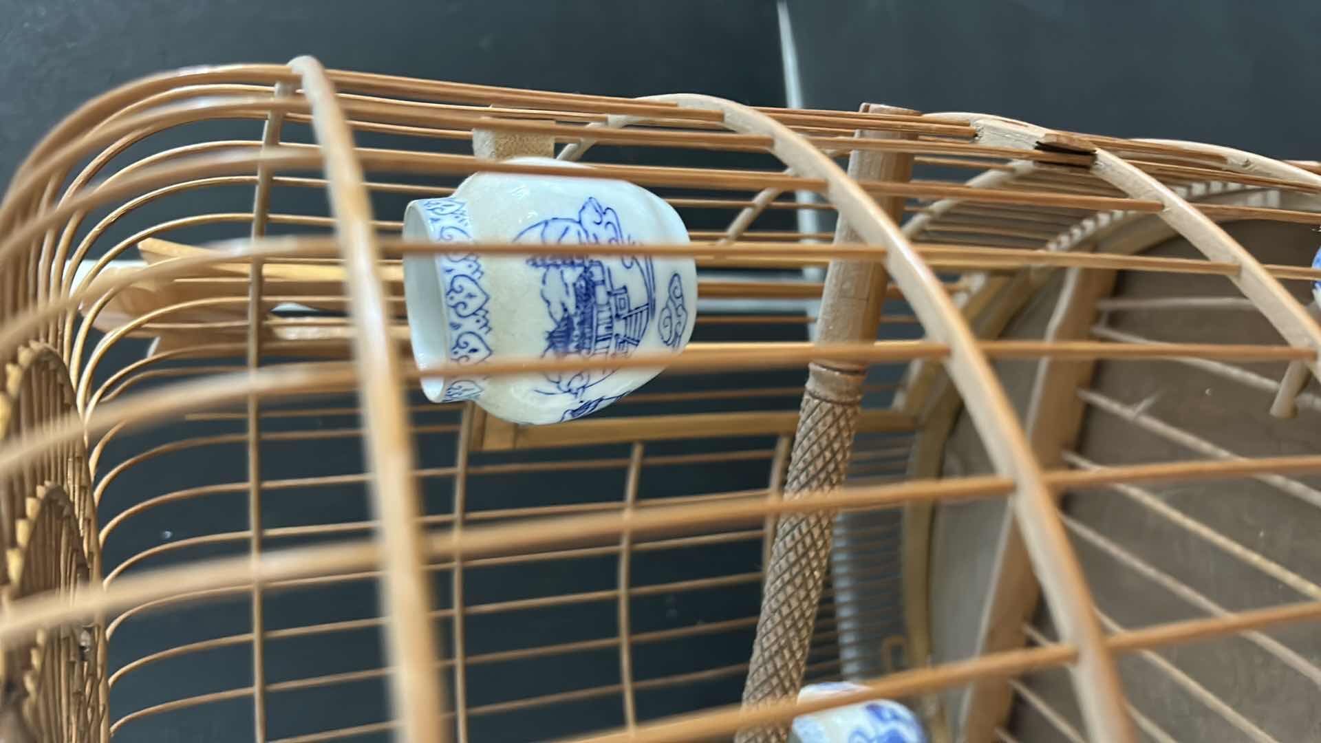 Photo 1 of ANTIQUE CHINESE WOVEN HANDMADE BIRDCAGE WITH PORCELAIN POTTERY FEEDERS 14” x 23”