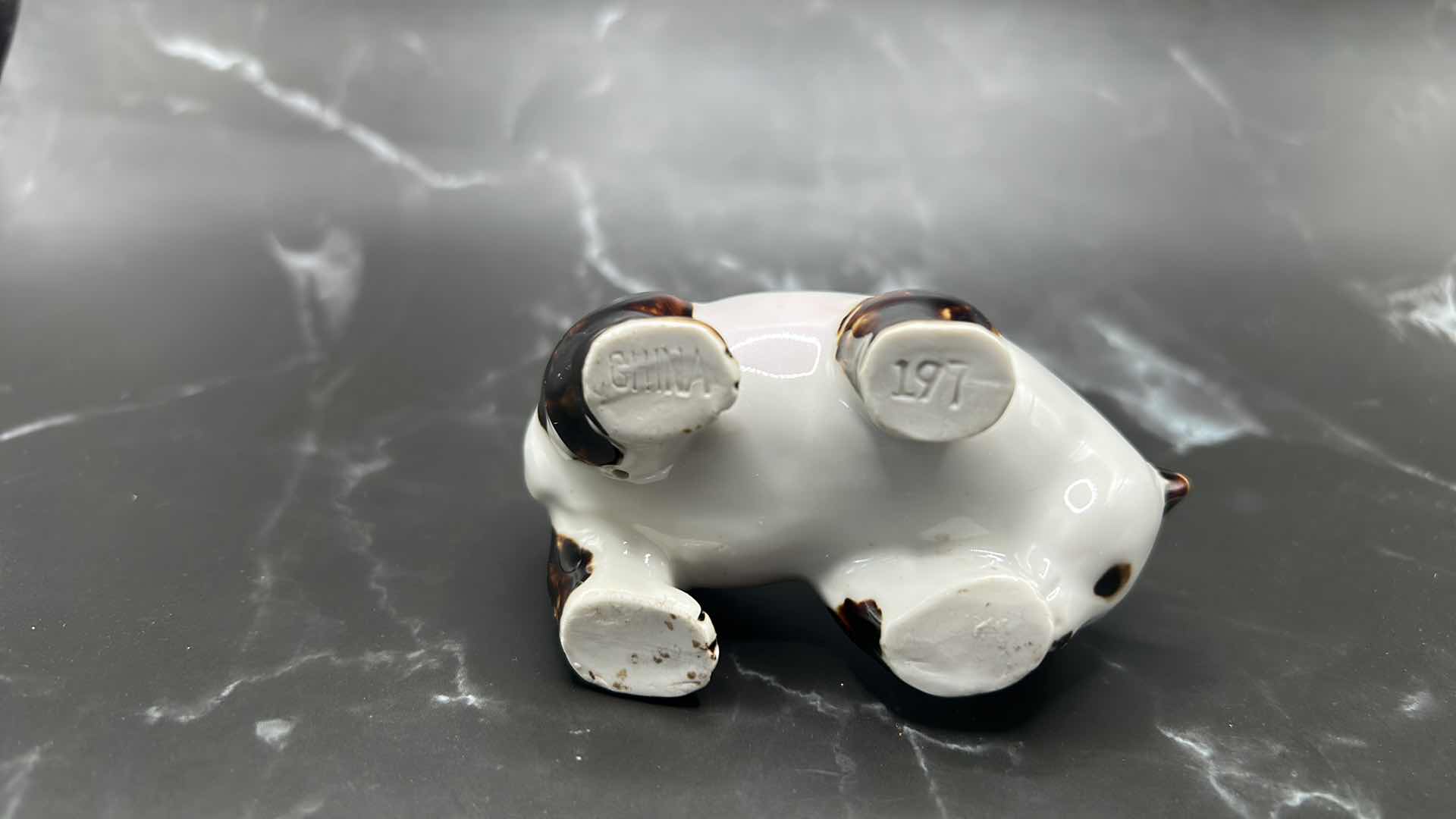 Photo 1 of 2- CHINESE COLLECTIBLES- STAMPED NUMBERED PORCELAIN PANDA BEAR. FRAMED SILK FABRIC W SILK THREADS (panda bear is 3 1/2” x 2”)