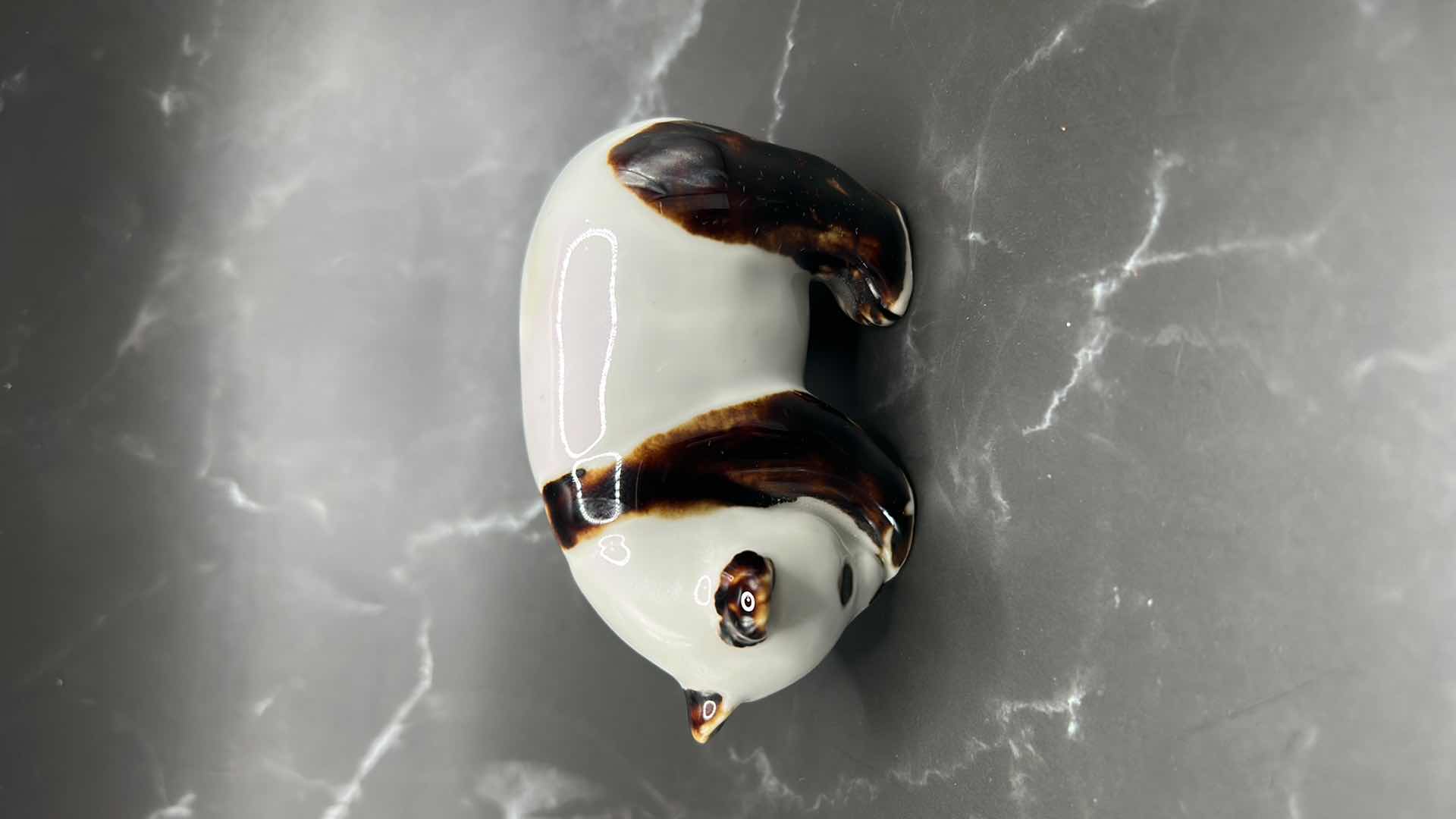 Photo 1 of 2- CHINESE COLLECTIBLES- STAMPED NUMBERED PORCELAIN PANDA BEAR. FRAMED SILK FABRIC W SILK THREADS (panda bear is 3 1/2” x 2”)