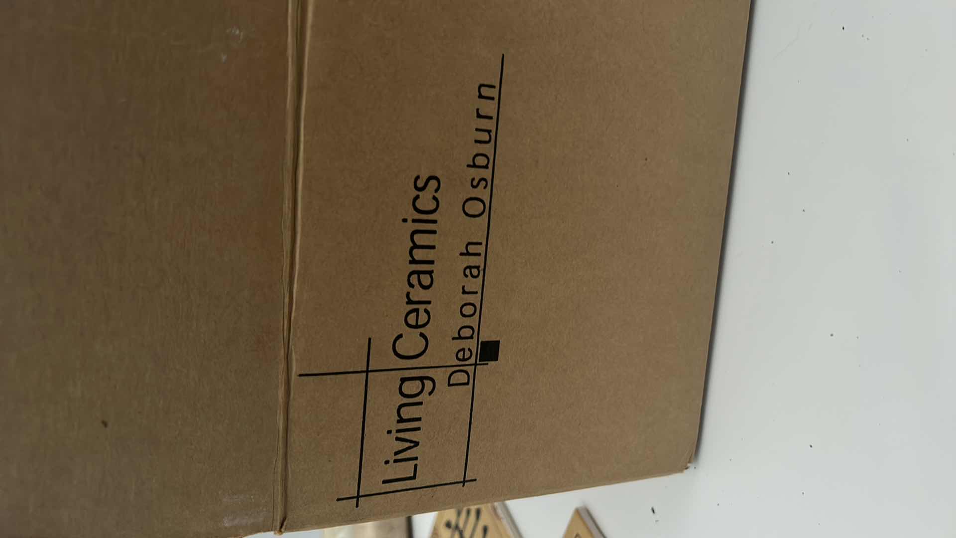 Photo 1 of BOX OF SMALL CERAMIC TILES BY DEBRA OSBURN LIVING CERAMICS AND 3 ROLLS OF WALLPAPER 