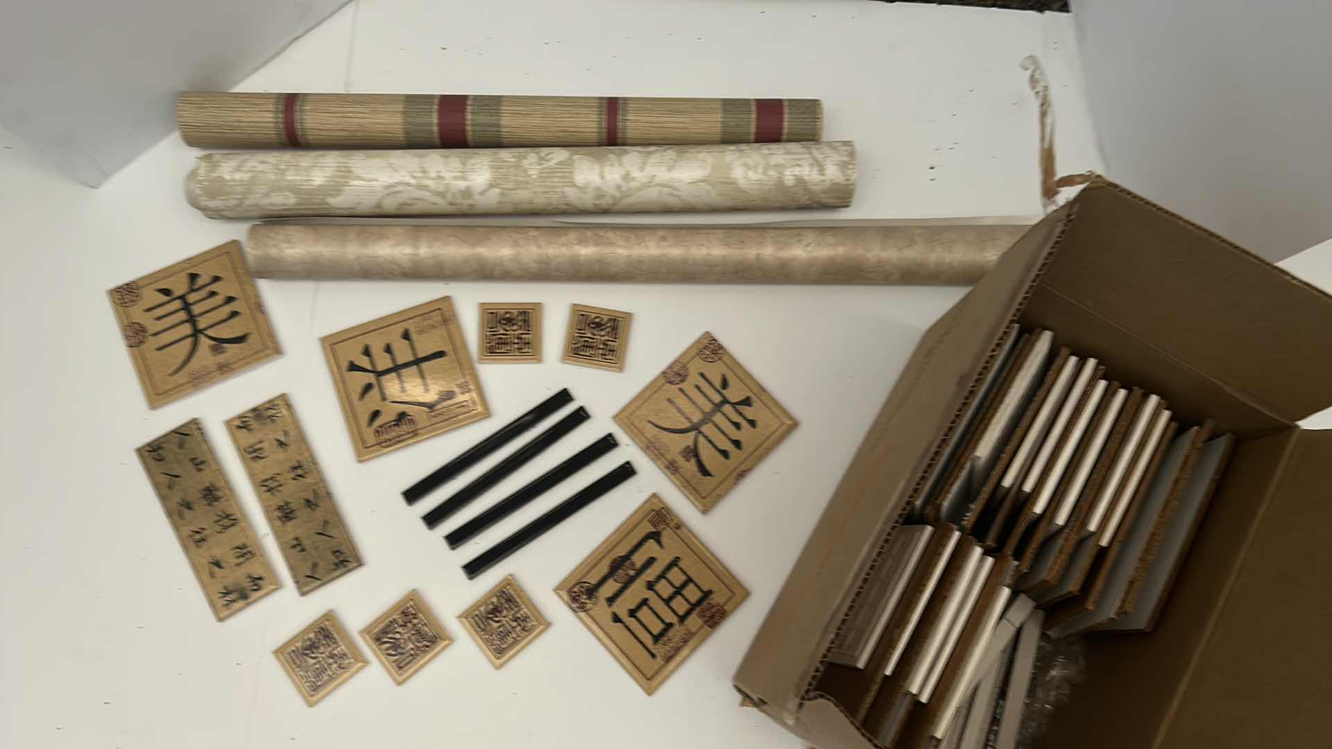 Photo 1 of BOX OF SMALL CERAMIC TILES BY DEBRA OSBURN LIVING CERAMICS AND 3 ROLLS OF WALLPAPER 
