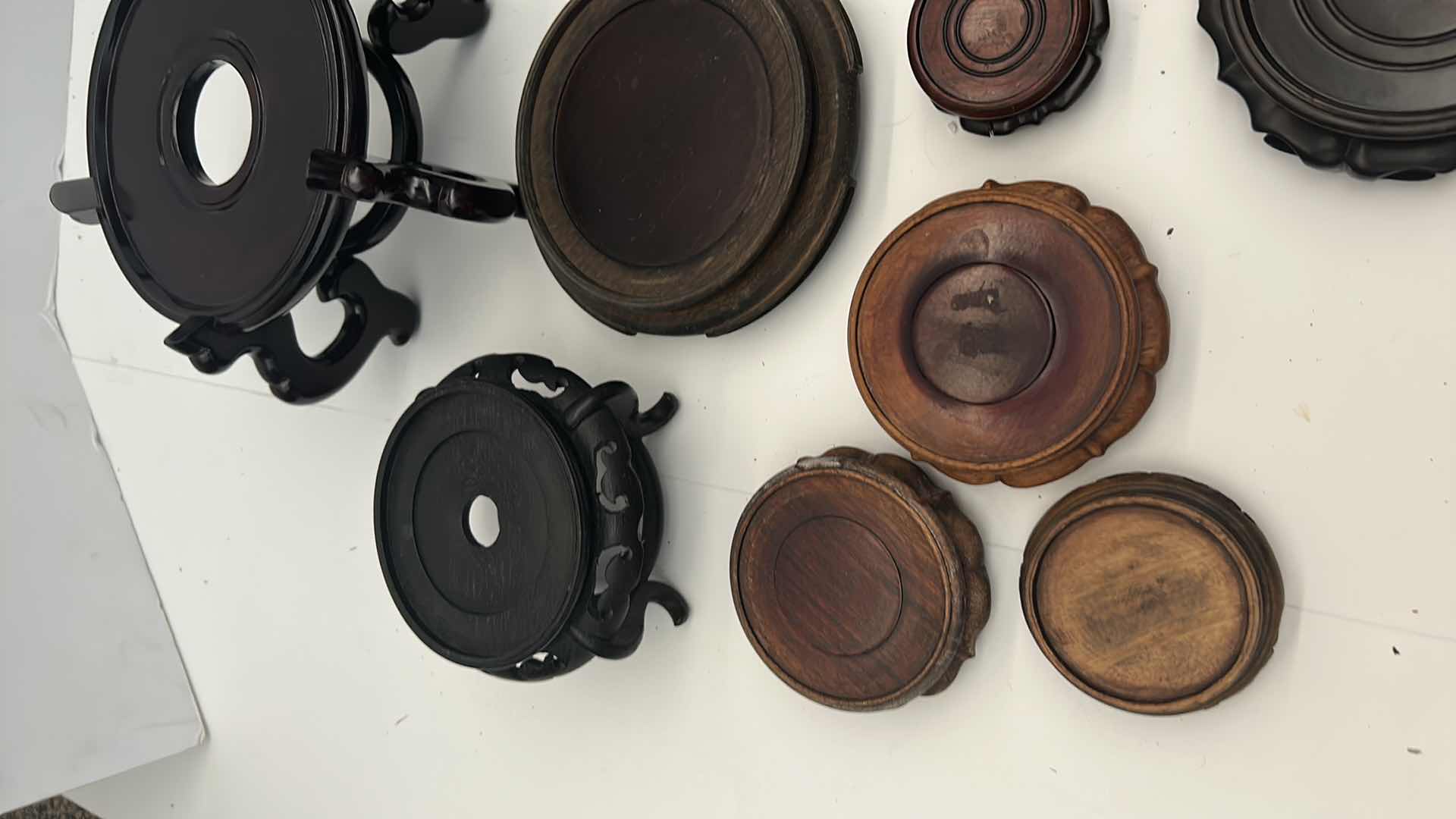 Photo 1 of BOX OF CHINESE WOOD VASE / POT STANDS, LARGEST FITS  7.25” BASE