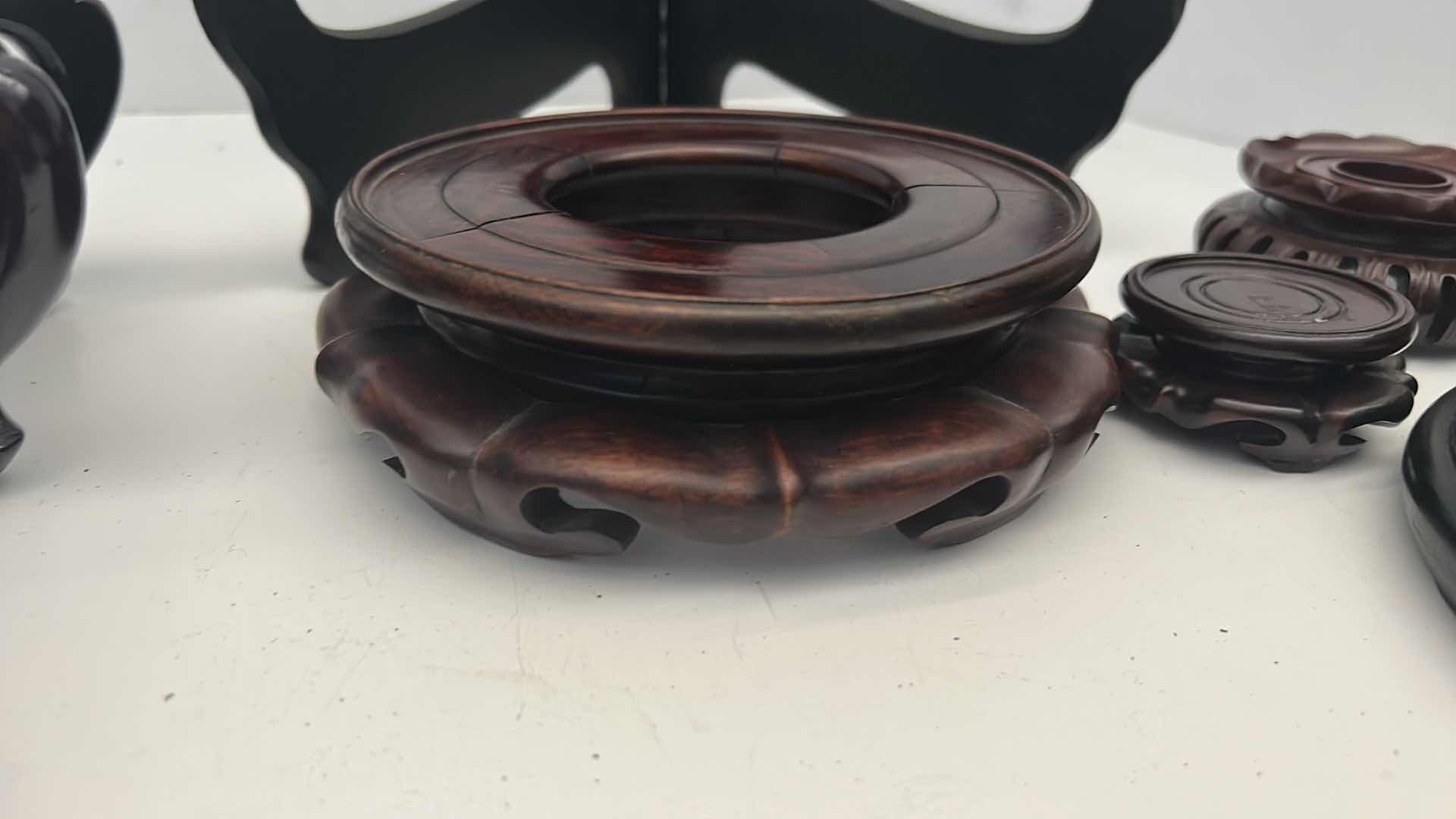 Photo 1 of BOX OF CHINESE WOOD VASE / POT STANDS, LARGEST FITS  7.25” BASE