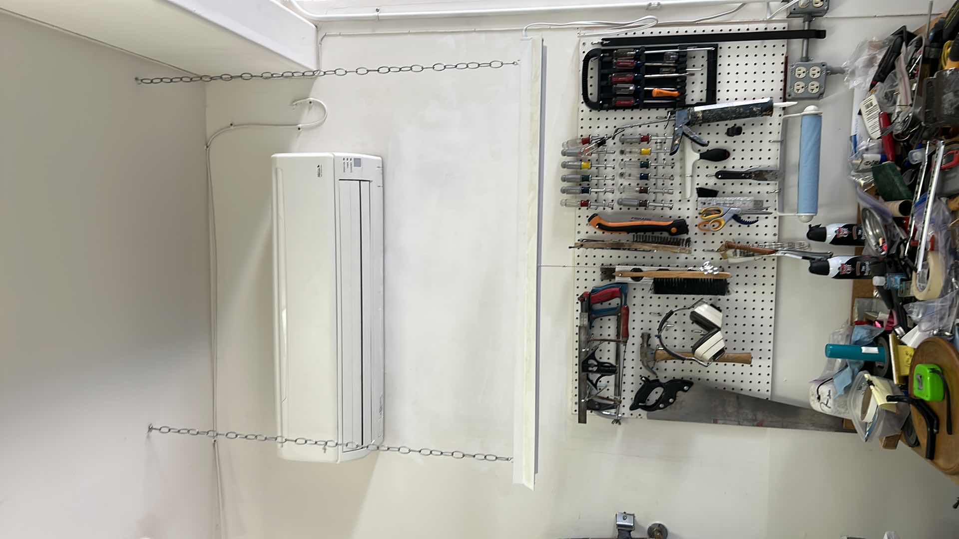 Photo 1 of CONTENTS SIDE WALL IN GARAGE, INCLUDES WORK BENCH, AND ALL TOOLS ON BENCH, PEG BOARD AND HANGING LIGHT FIXTURE 43” x 25.5” x H38”