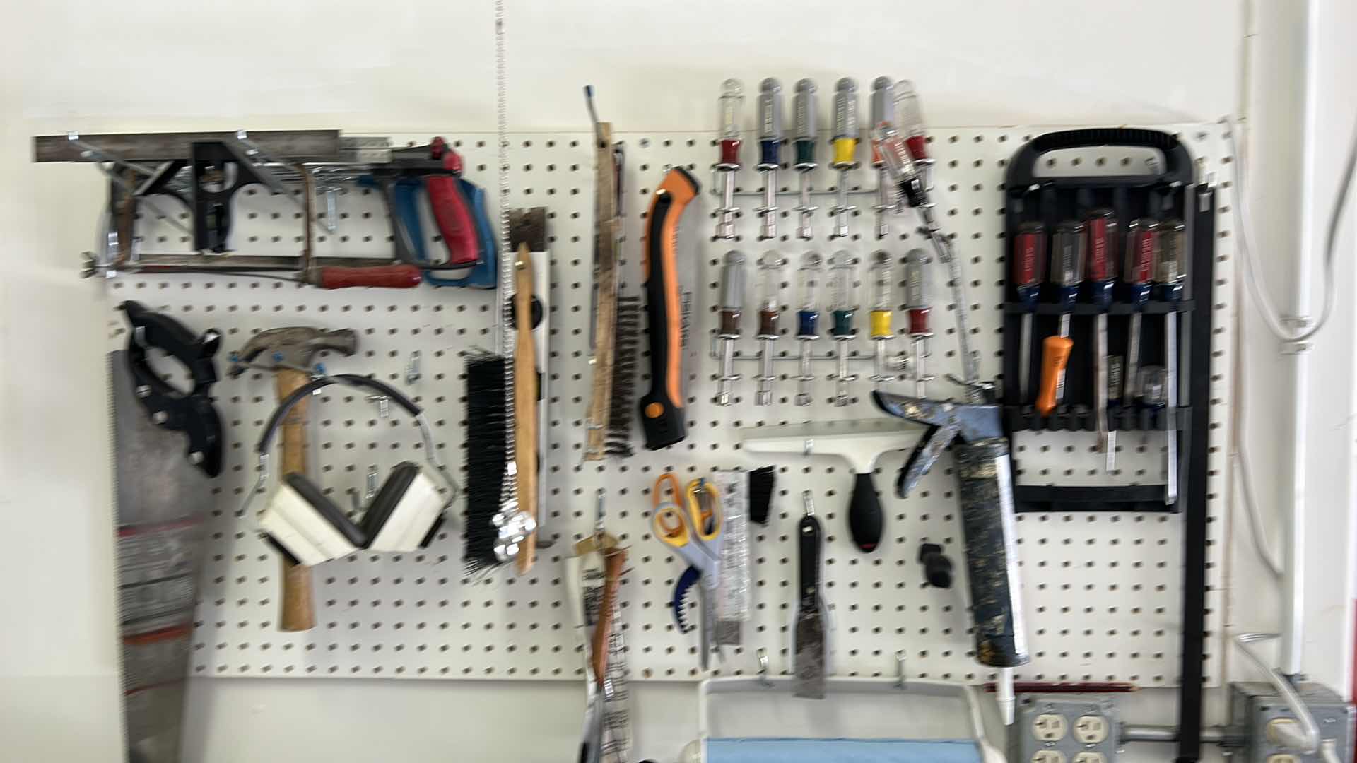 Photo 1 of CONTENTS SIDE WALL IN GARAGE, INCLUDES WORK BENCH, AND ALL TOOLS ON BENCH, PEG BOARD AND HANGING LIGHT FIXTURE 43” x 25.5” x H38”