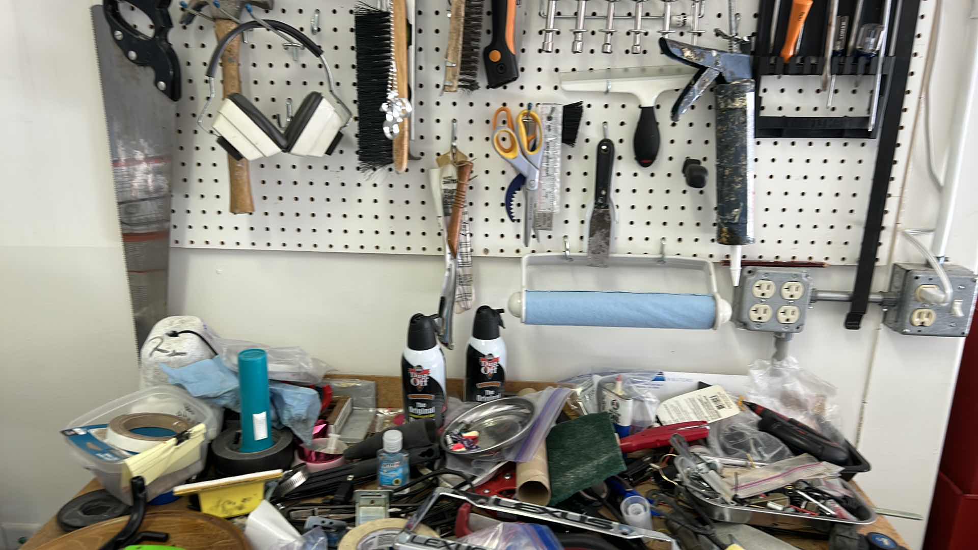 Photo 1 of CONTENTS SIDE WALL IN GARAGE, INCLUDES WORK BENCH, AND ALL TOOLS ON BENCH, PEG BOARD AND HANGING LIGHT FIXTURE 43” x 25.5” x H38”