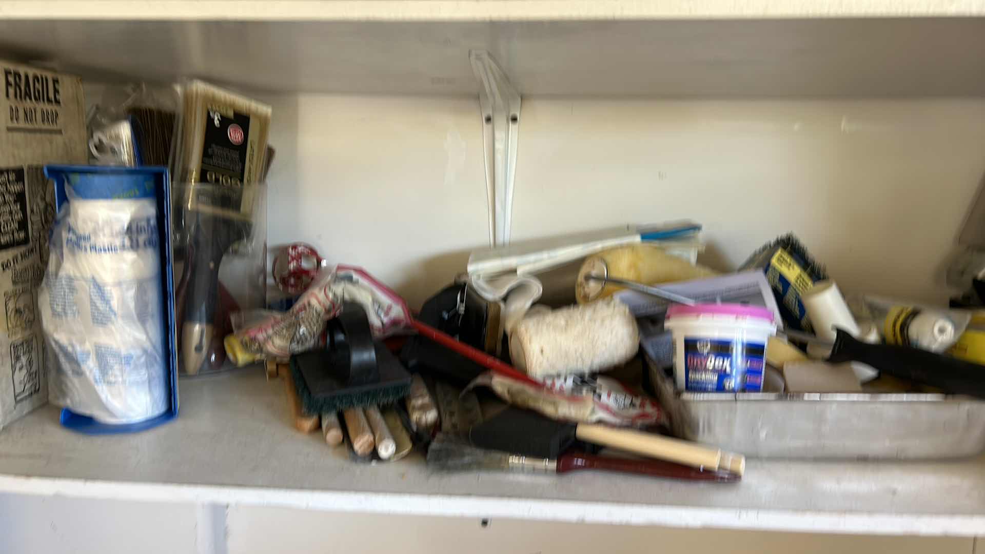 Photo 1 of CONTENTS OF TWO SHELVES IN GARAGE