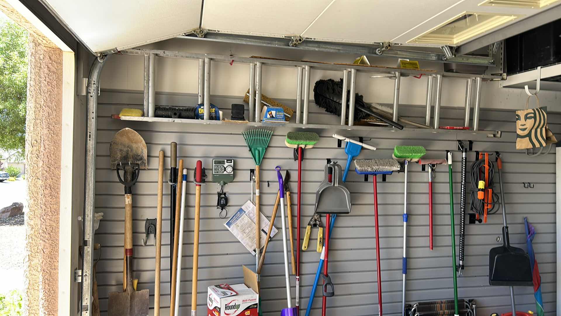 Photo 1 of CONTENTS OF SIDE WALL IN GARAGE INCLUDES LADDER (buyer to remove)