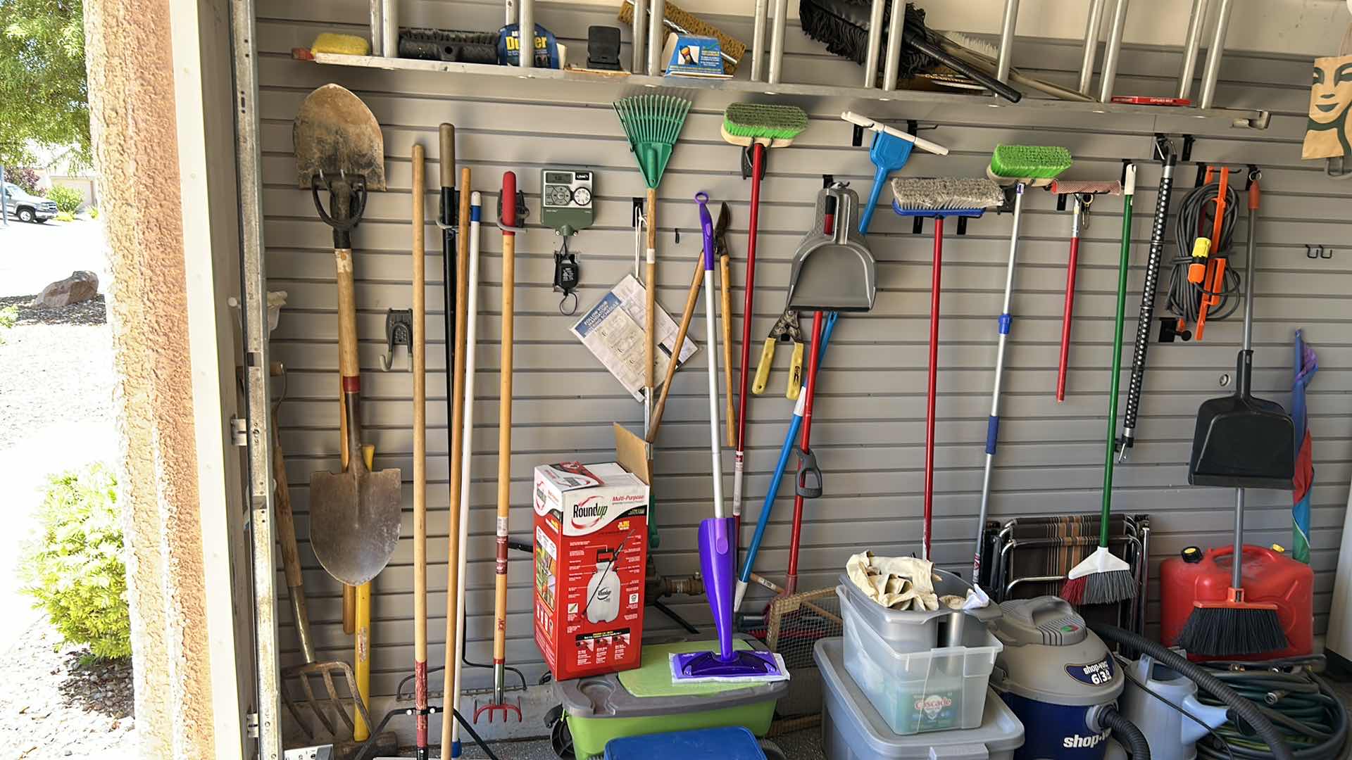 Photo 1 of CONTENTS OF SIDE WALL IN GARAGE INCLUDES LADDER (buyer to remove)