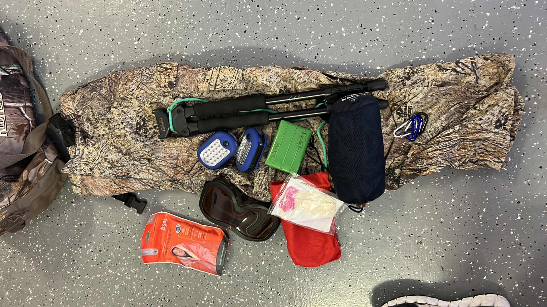 Photo 1 of MENS CAMO TOTE WITH CAMPING AND HUNTING GEAR