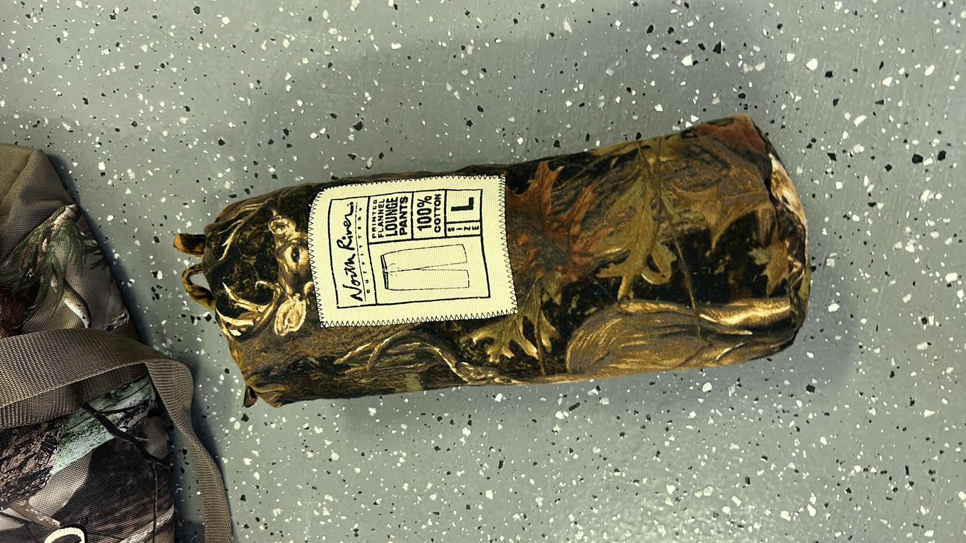 Photo 1 of MENS CAMO TOTE WITH CAMPING AND HUNTING GEAR