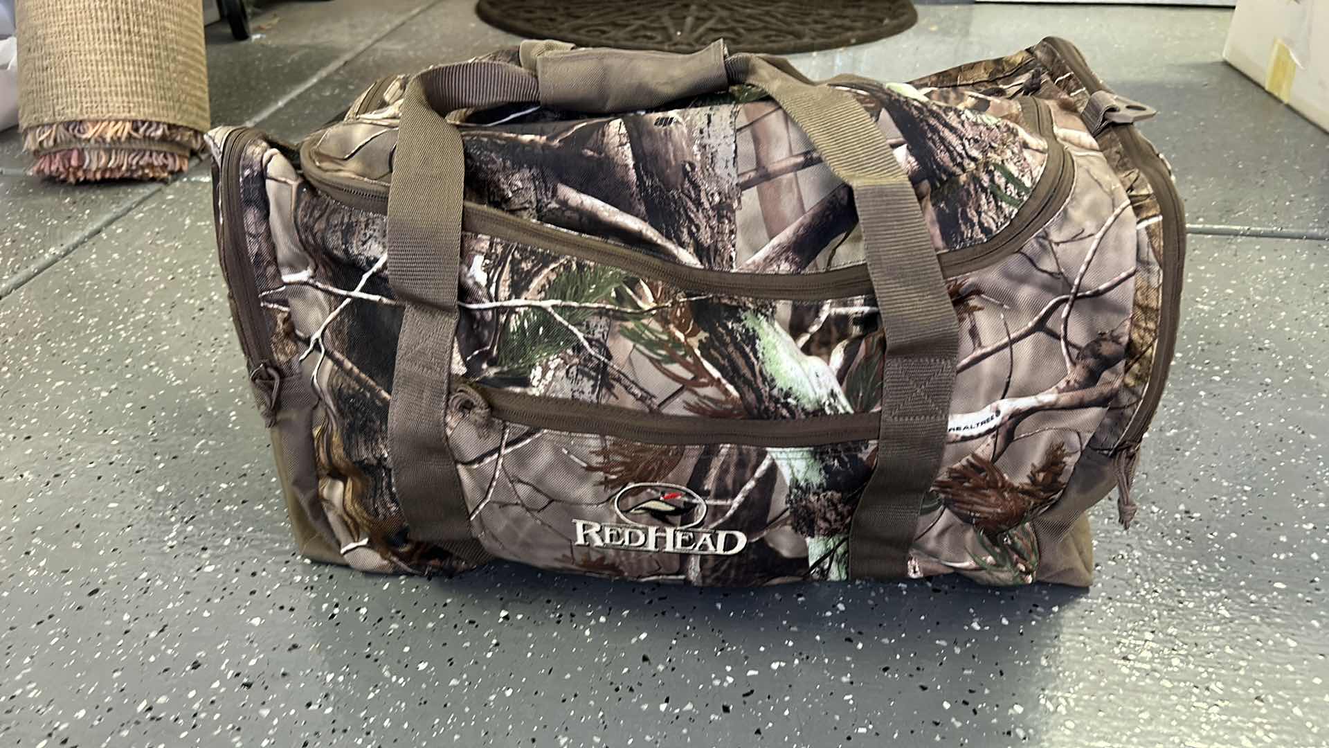 Photo 1 of MENS CAMO TOTE WITH CAMPING AND HUNTING GEAR