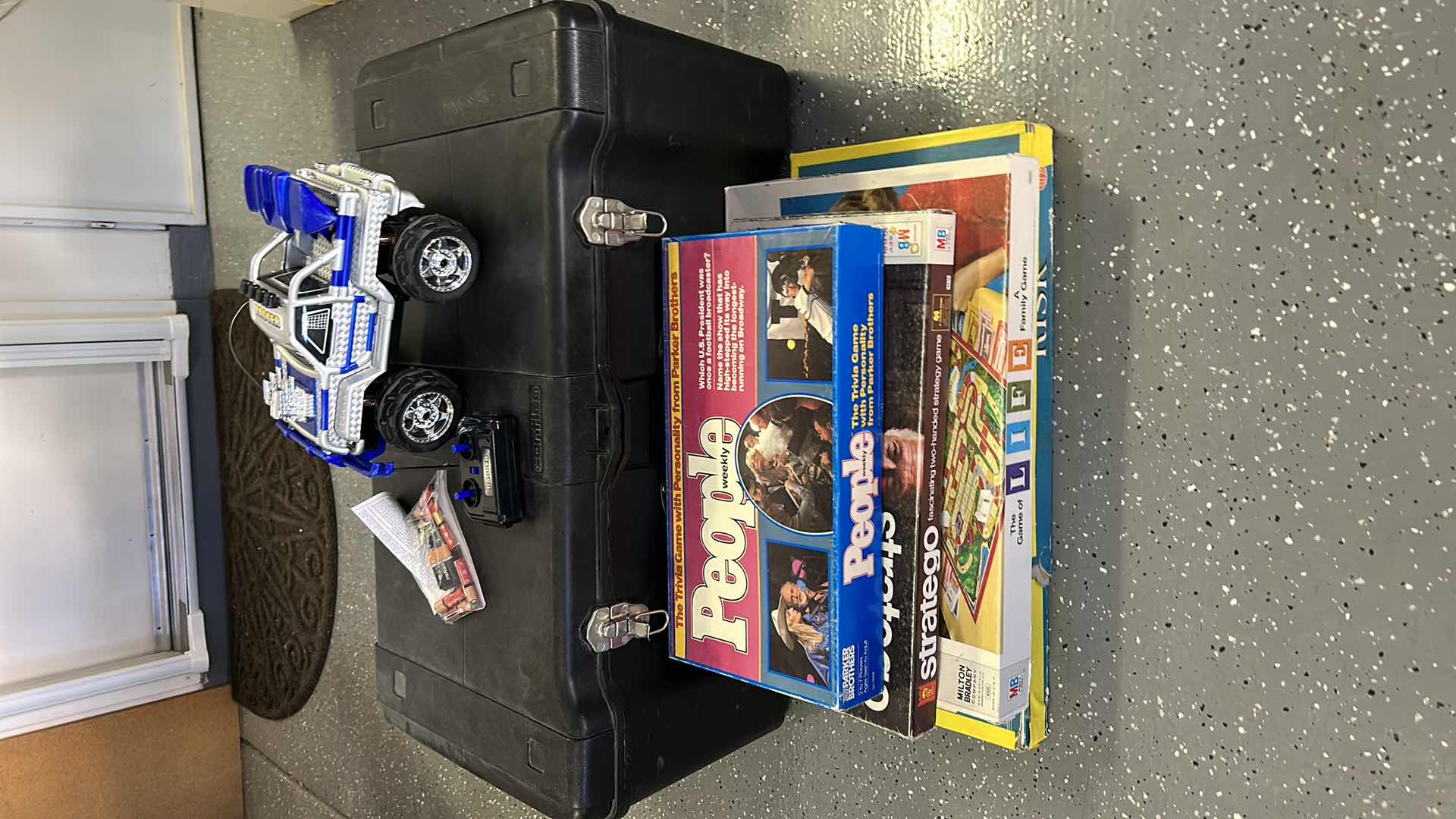 Photo 1 of LARGE BLACK TOTE WITH GAMES AND RC TRUCK