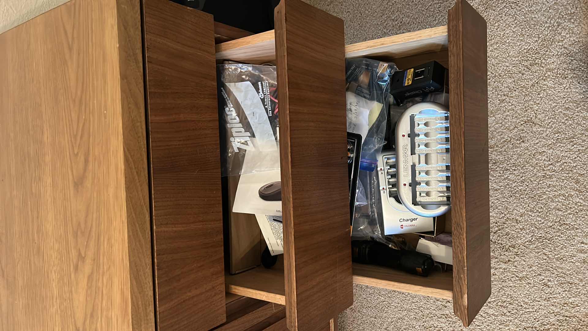 Photo 1 of CONTENTS OF 3 DRAWERS IN CONSOLE