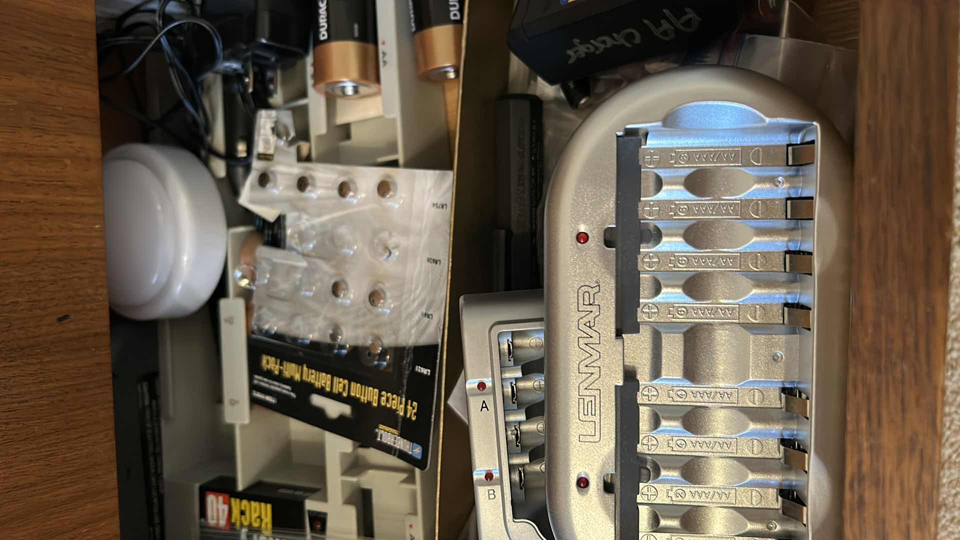 Photo 1 of CONTENTS OF 3 DRAWERS IN CONSOLE