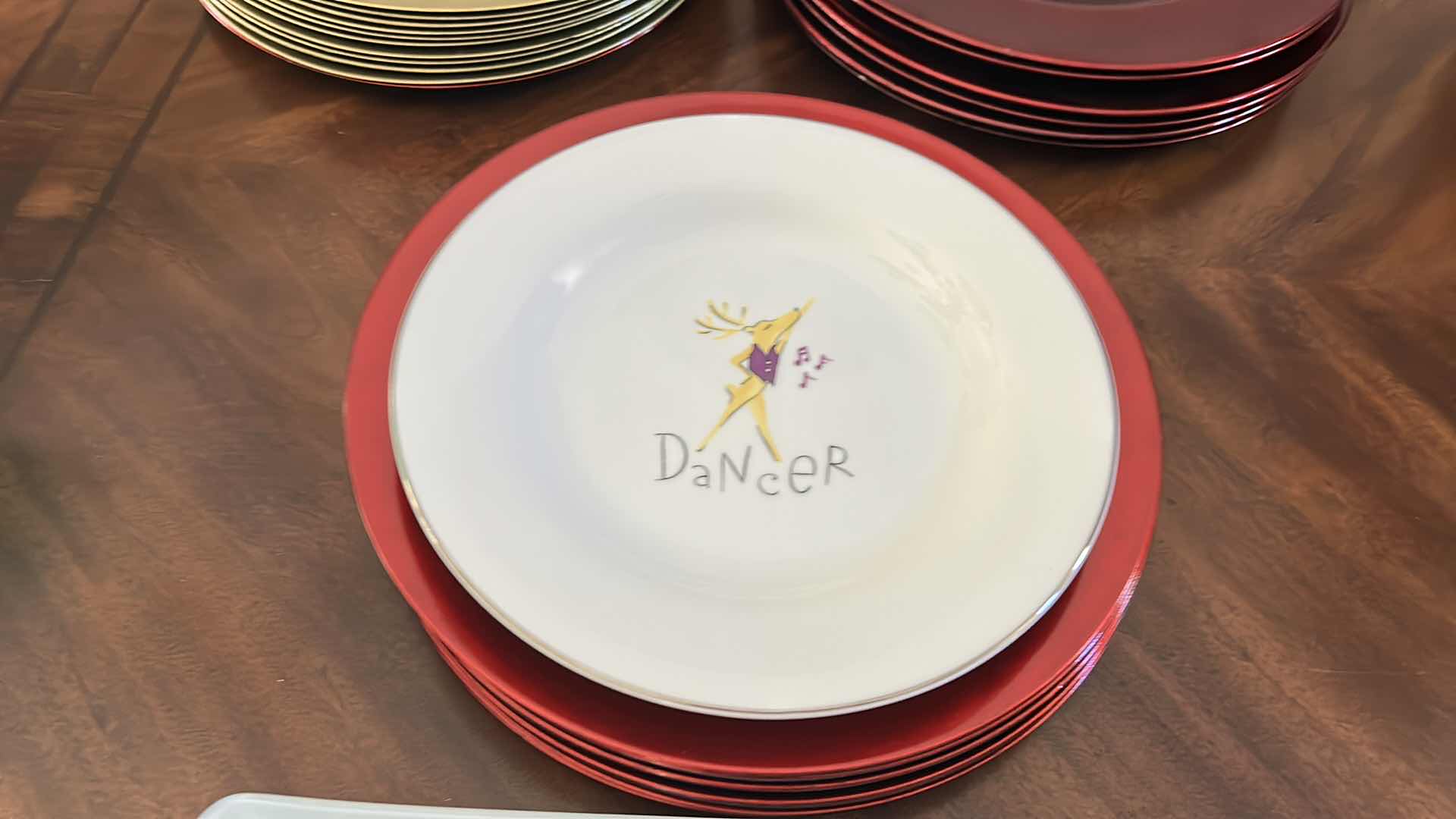 Photo 1 of KITCHEN ASSORTMENT- CHRISTMAS PLATTERS, REINDEER PLATE, RED AND GOLD PLATE CHARGERS