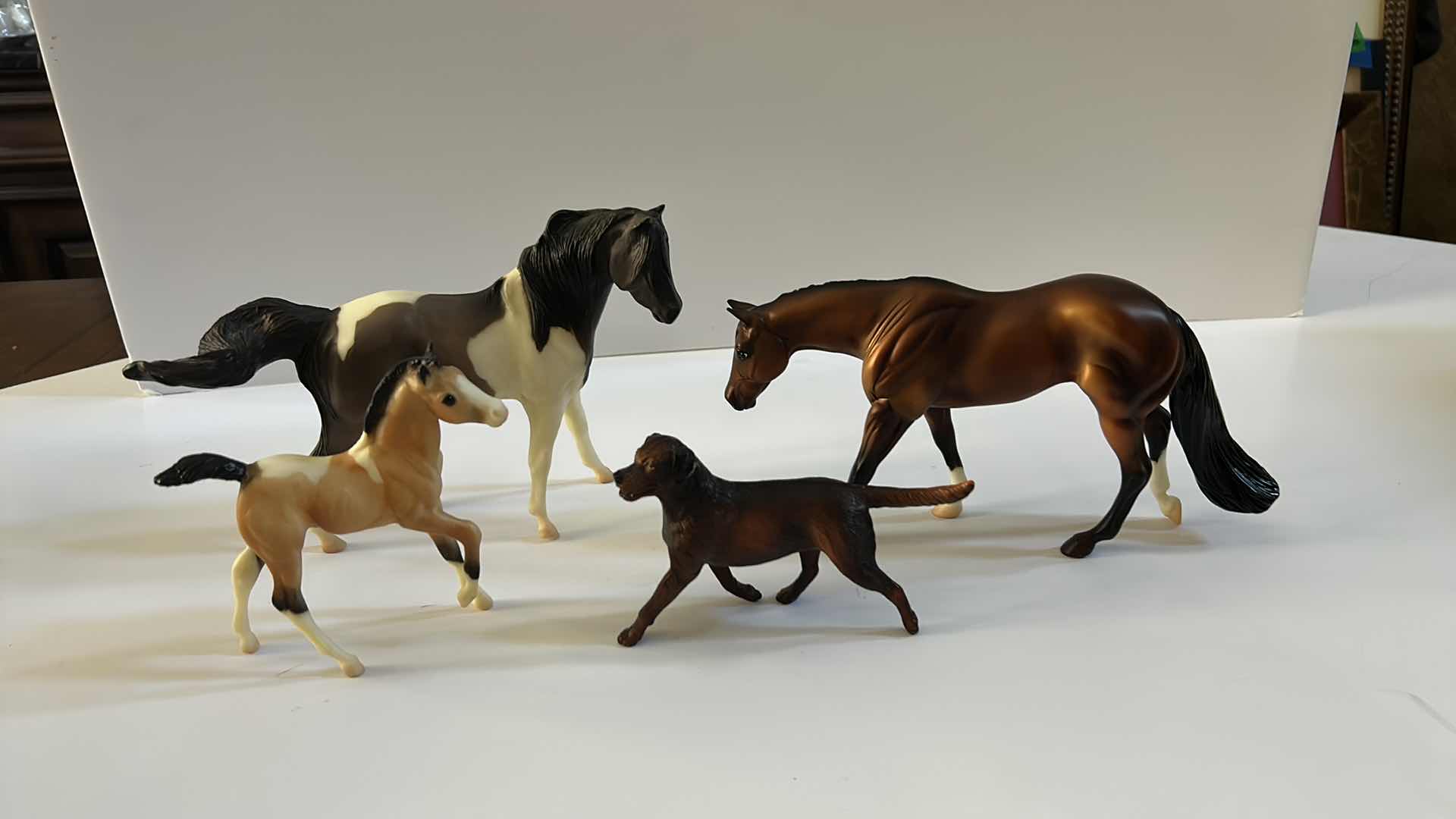 Photo 1 of 4 COLLECTIBLE FIGURES, 3 RESIN HORSES AND A DOG (TALLES HORSE IS 6")