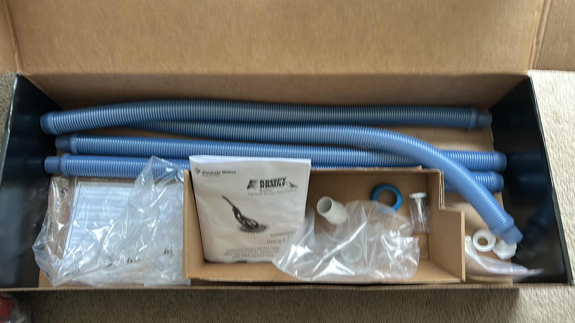 Photo 1 of TWO BOXES WITH REPLACEMENT TUBING FOR POOL CLEANER