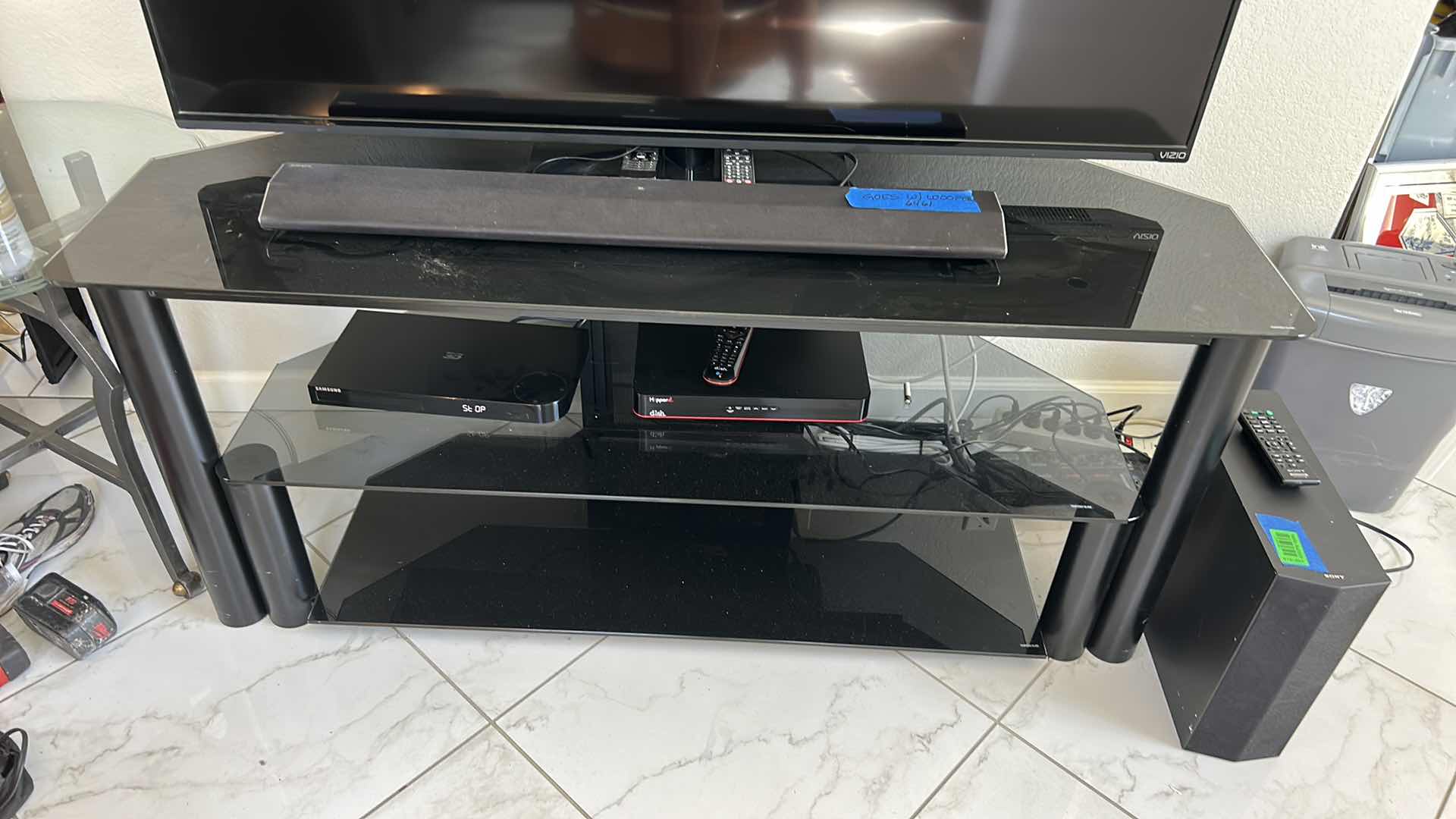 Photo 1 of BLACK METAL W TEMPERED GLASS SHELVES TV STAND W SHELVES NO ELECTRONICS INCLUDED 58” x 19” x 24”