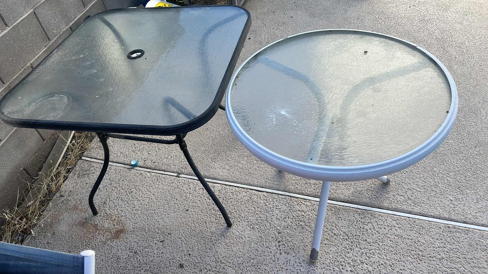 Photo 1 of TWO OUTDOOR TABLES, UMBRELLA (NEEDS LOWER POLE) AND WATERING JUG