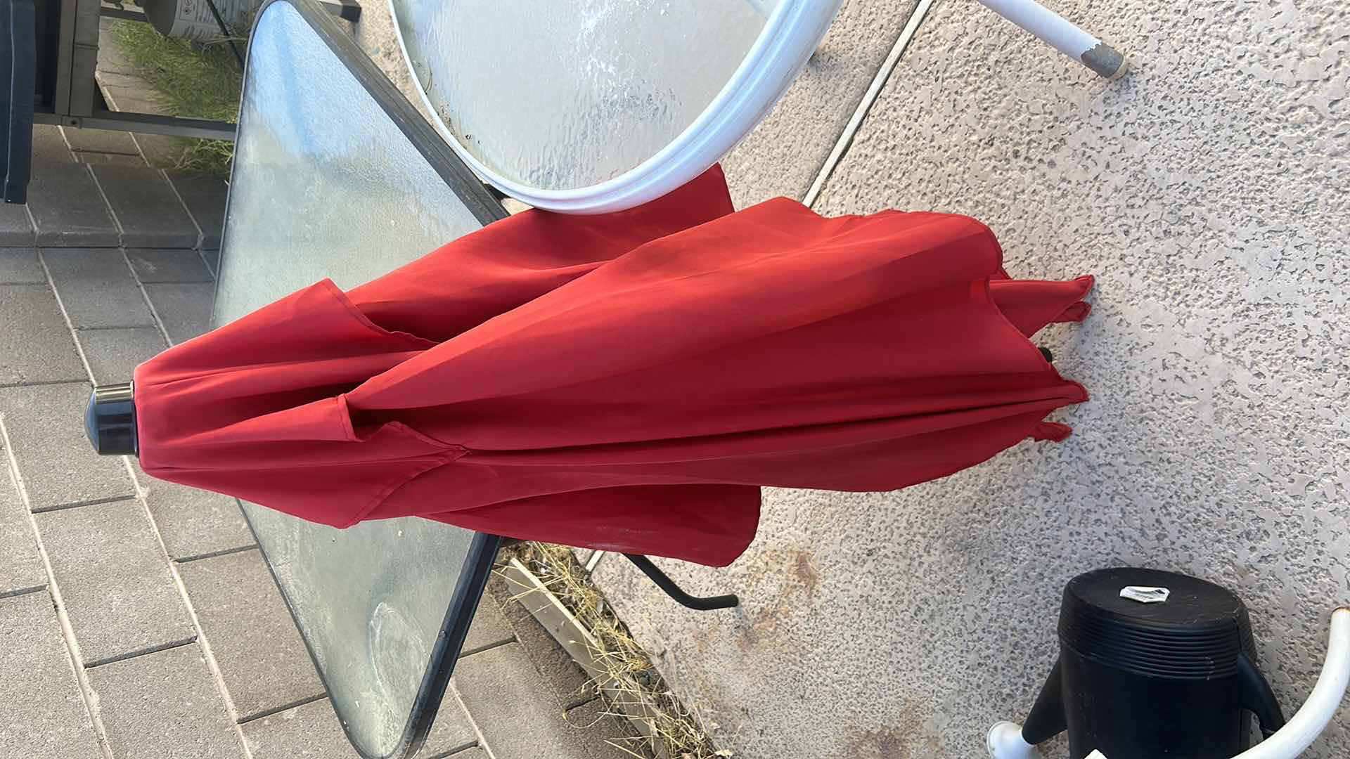 Photo 1 of TWO OUTDOOR TABLES, UMBRELLA (NEEDS LOWER POLE) AND WATERING JUG