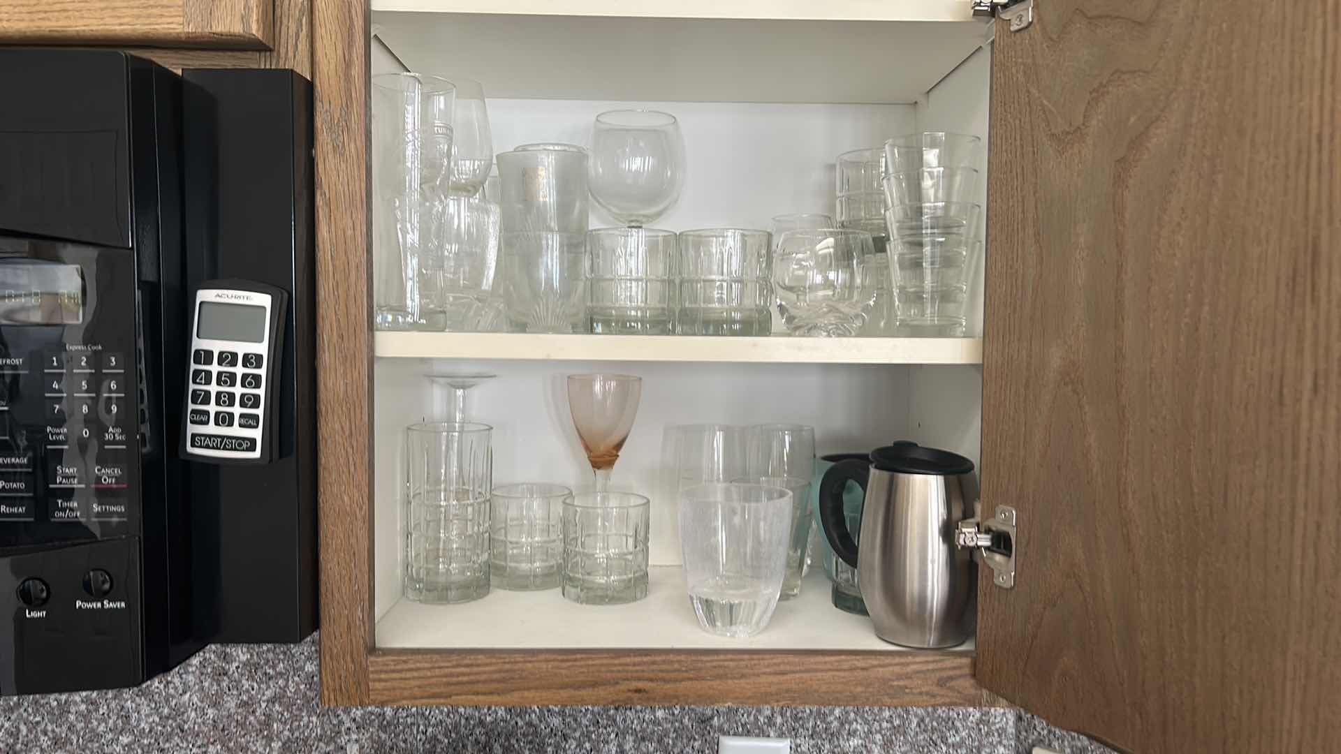 Photo 1 of CONTENTS OF KITCHEN CABINET