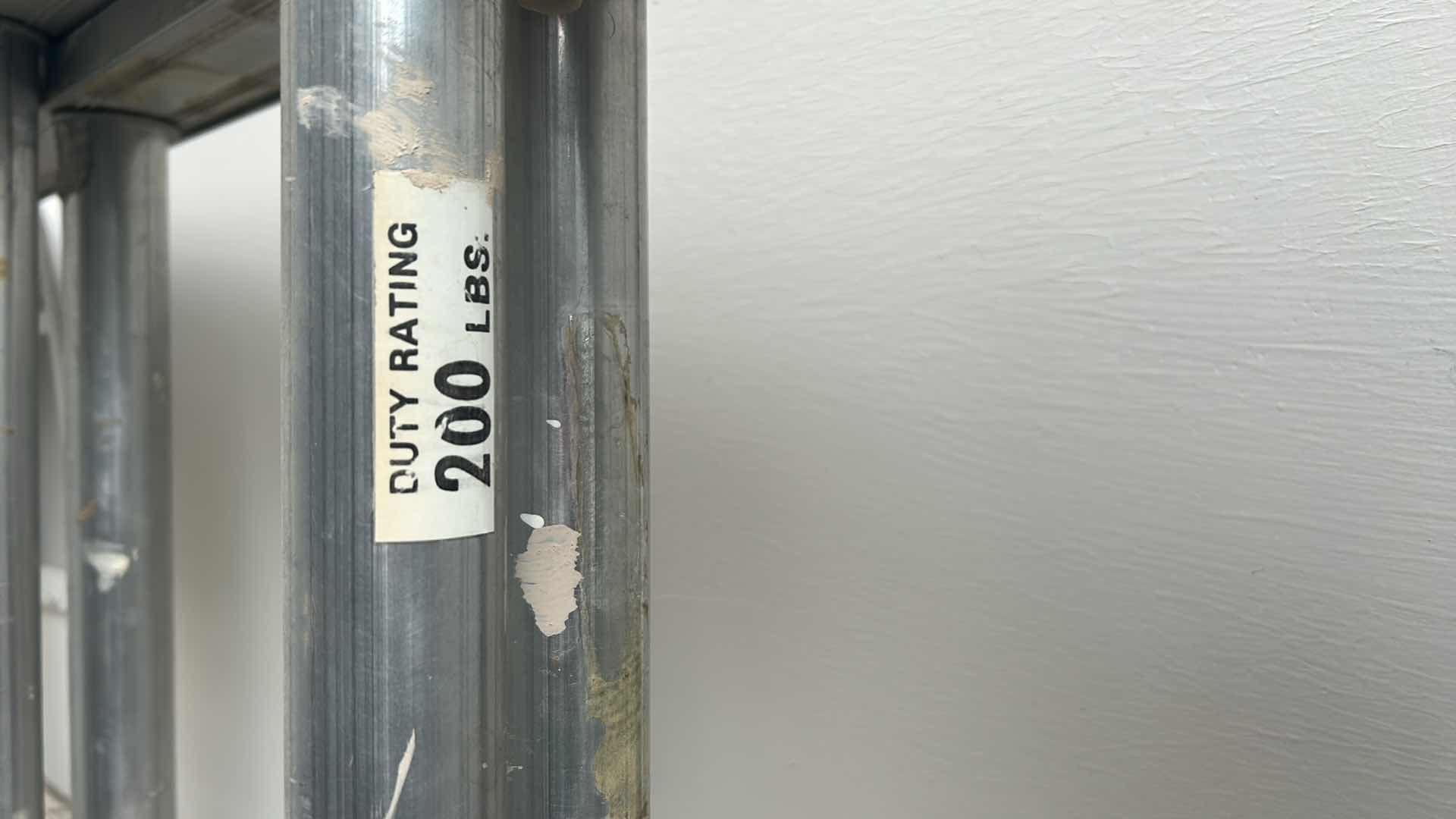 Photo 1 of ALUMINUM ADJUSTABLE SLIDING LADDER 8’ to 26’