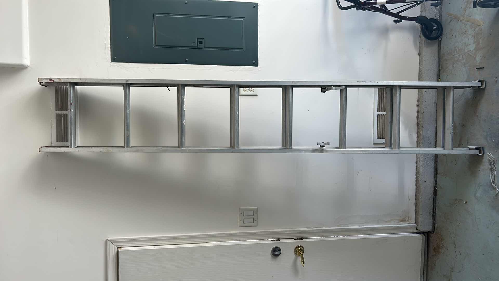 Photo 1 of ALUMINUM ADJUSTABLE SLIDING LADDER 8’ to 26’