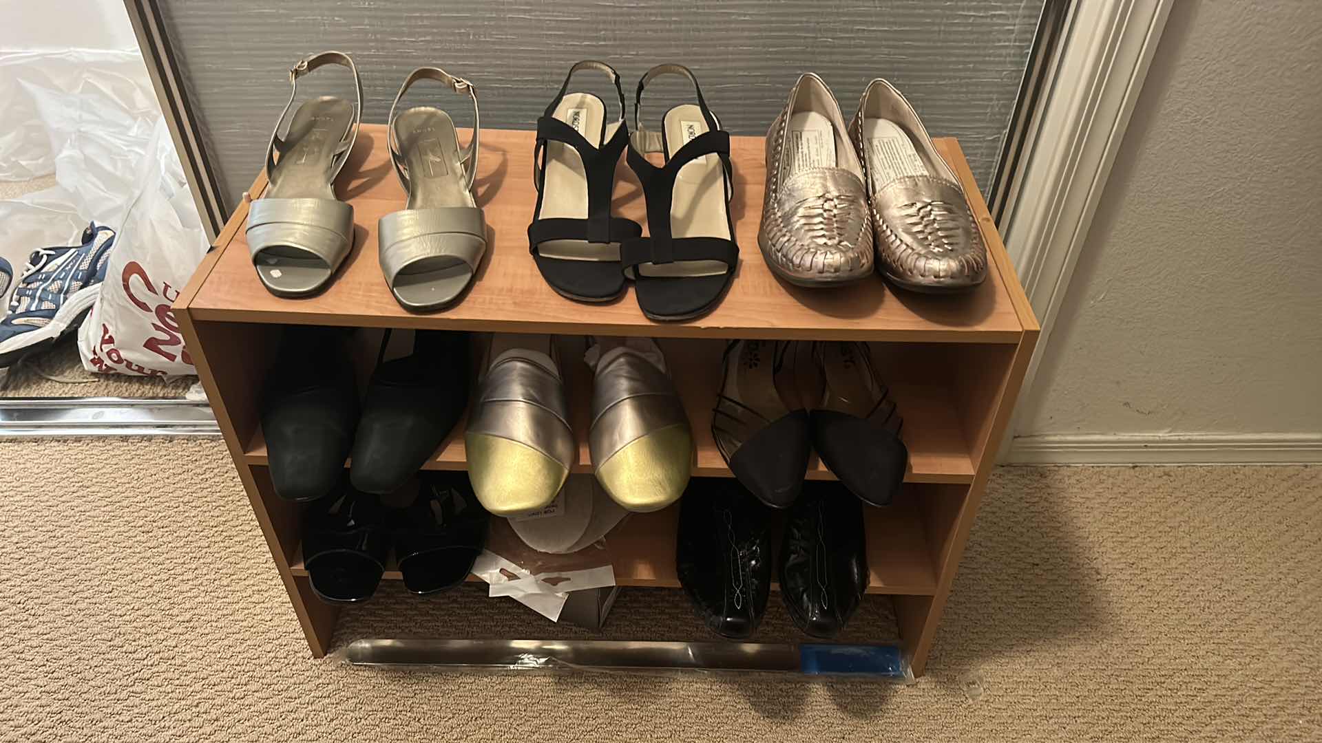 Photo 1 of WOMENS SHOE ASSORTMENT SIZE 11 PLUS SHOE RACK