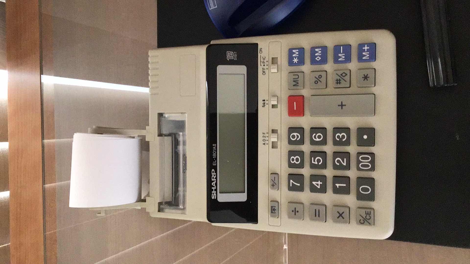 Photo 1 of OFFICE ASSORTMENT AUTOMATED CHANGE BANK, CALCULATOR AND MORE