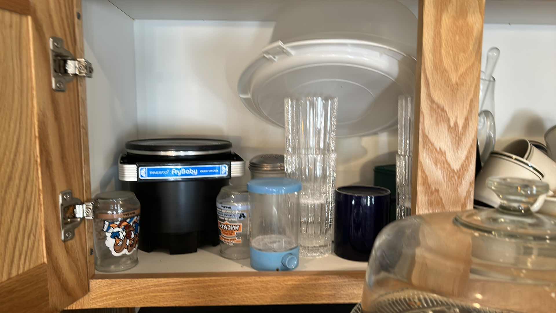 Photo 1 of CONTENTS OF KITCHEN CABINET AND TOP OF REFRIGERATOR