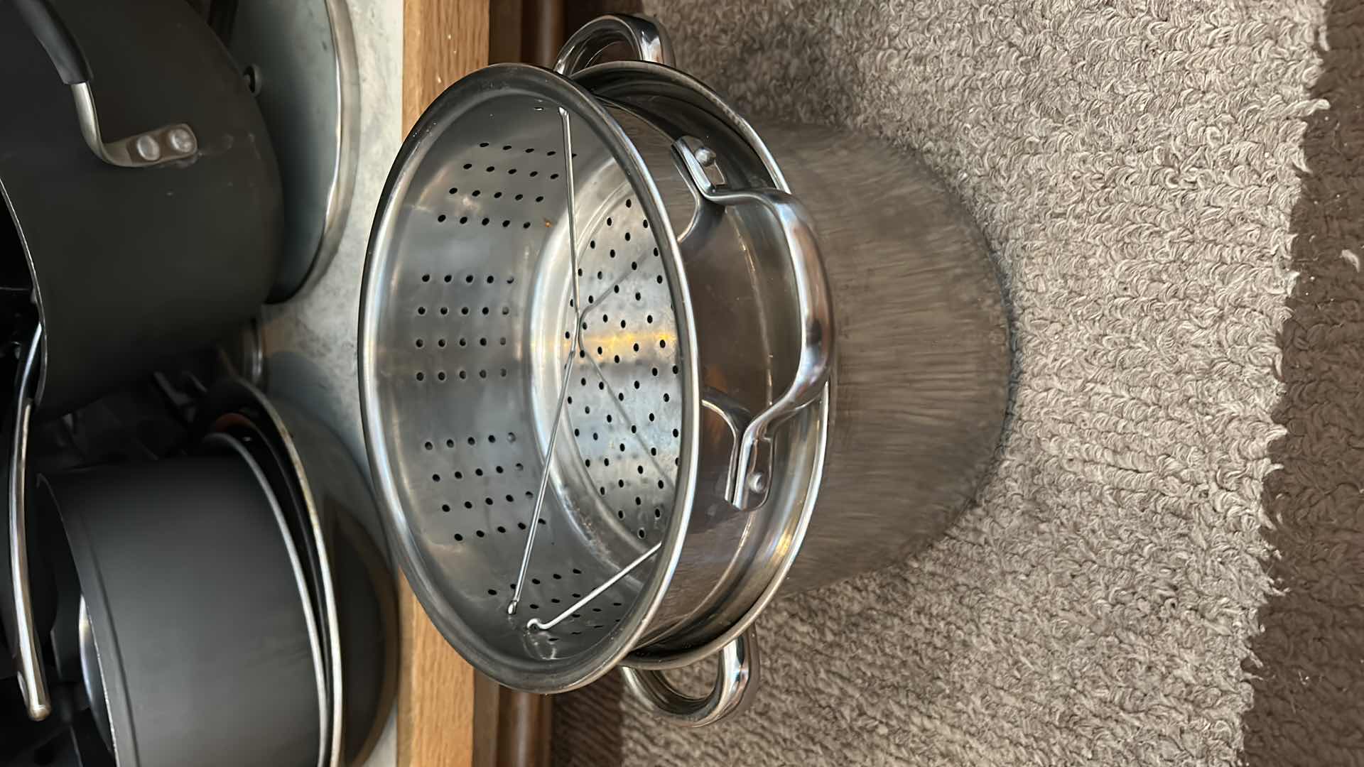 Photo 1 of CONTENTS OF KITCHEN CABINET-.POTS PANS AND MORE