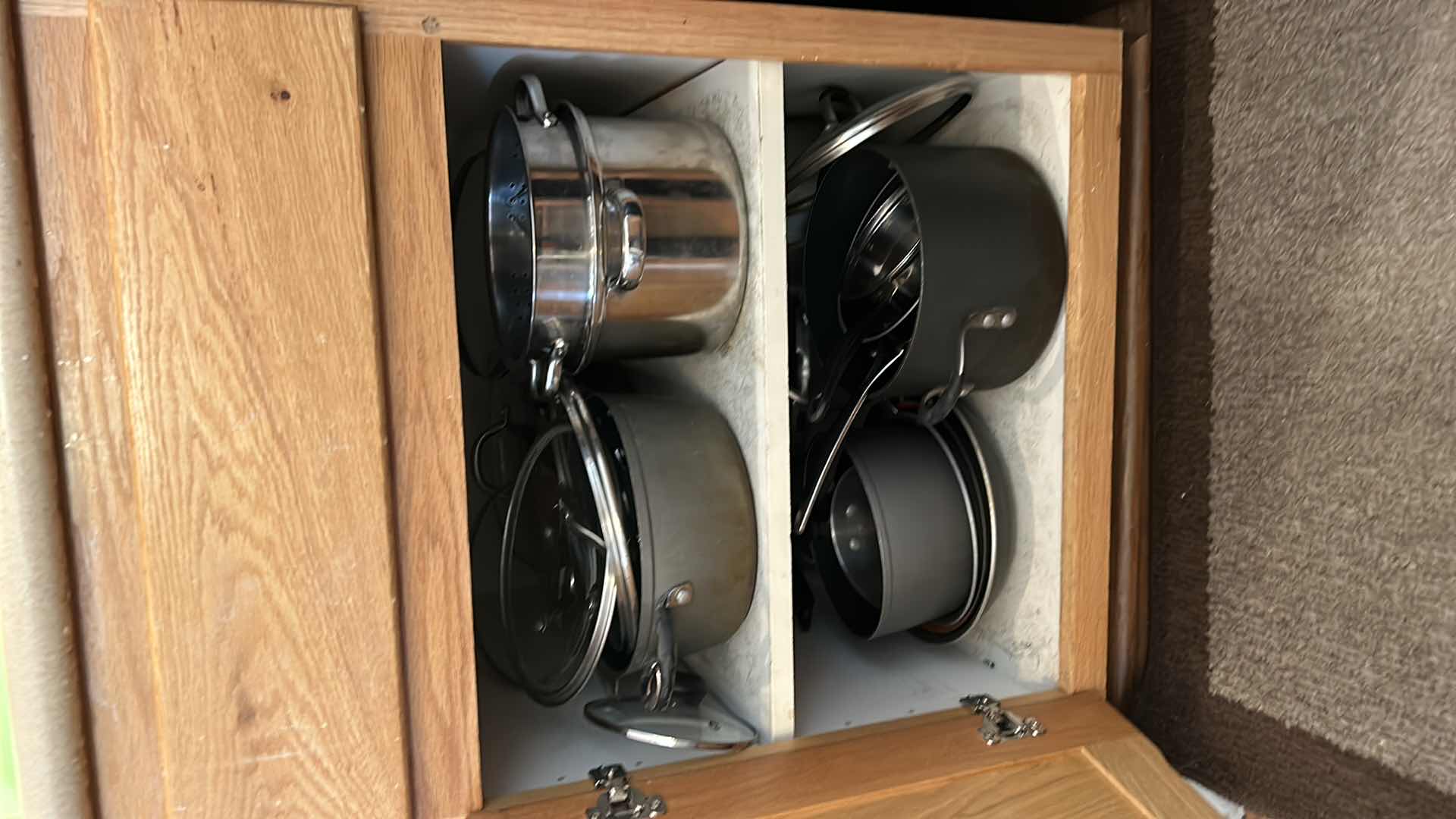 Photo 1 of CONTENTS OF KITCHEN CABINET-.POTS PANS AND MORE