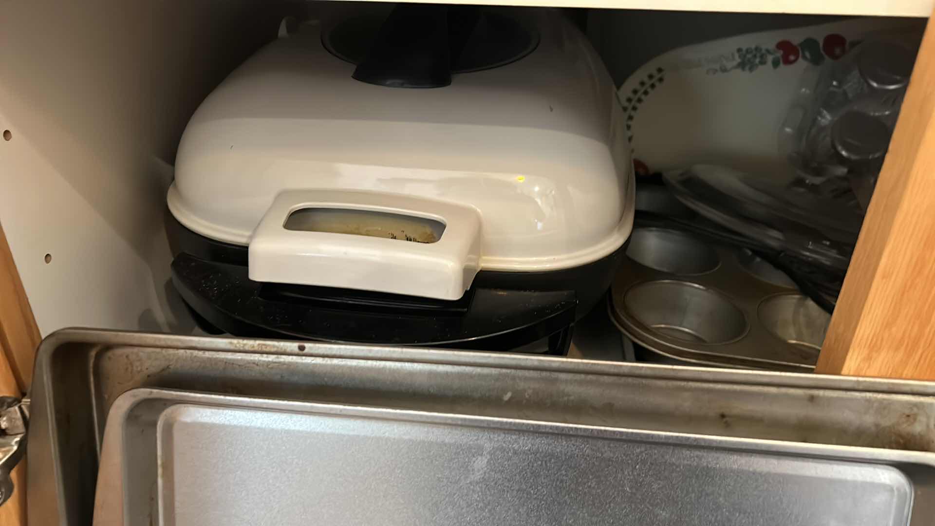 Photo 1 of CONTENTS OF KITCHEN CABINET- GRIDDLE, DEEP FRYER AND BAKEWARE