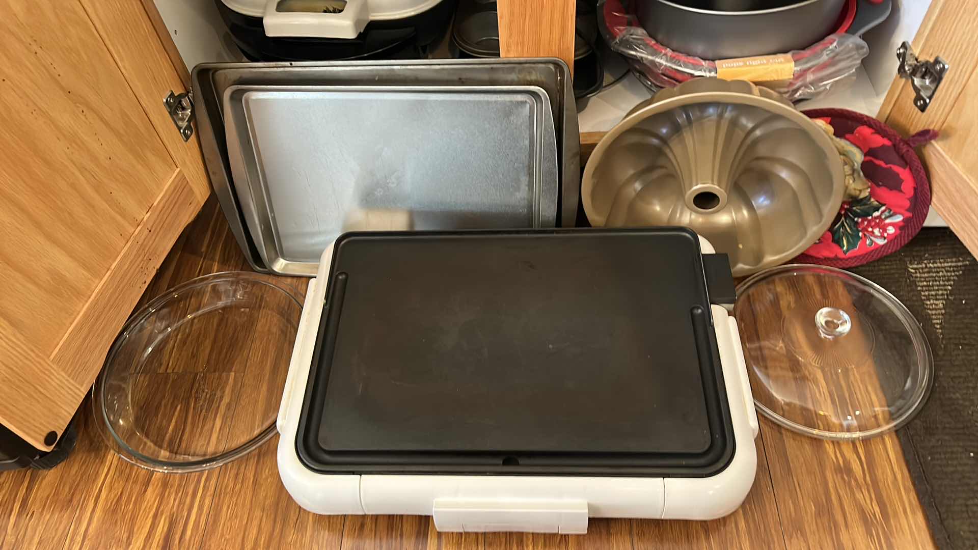 Photo 1 of CONTENTS OF KITCHEN CABINET- GRIDDLE, DEEP FRYER AND BAKEWARE