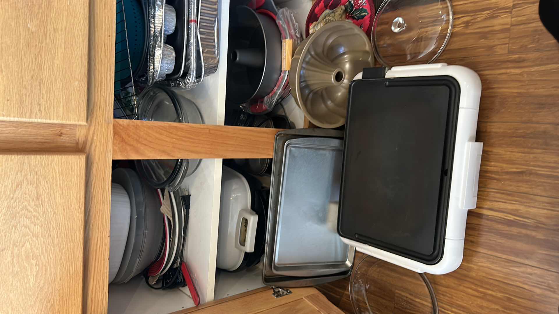 Photo 1 of CONTENTS OF KITCHEN CABINET- GRIDDLE, DEEP FRYER AND BAKEWARE