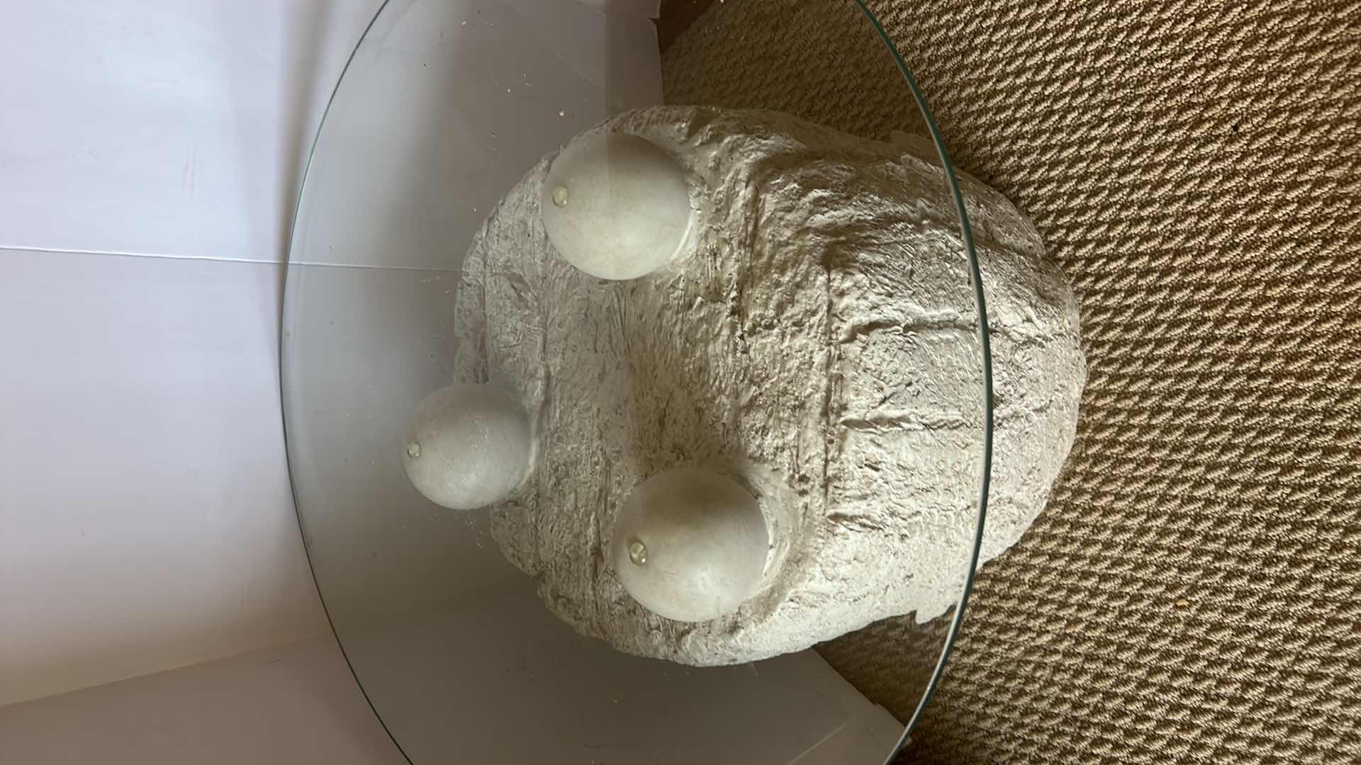 Photo 1 of UNIQUE POSTMODERN TESSELLATED STONE SIDE TABLE. Features a glass top which rests on three stone spheres., 
 23 1/2” x 19” ($300 to $800 online)